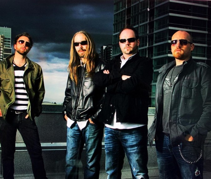 Four men standing and having their photo taken