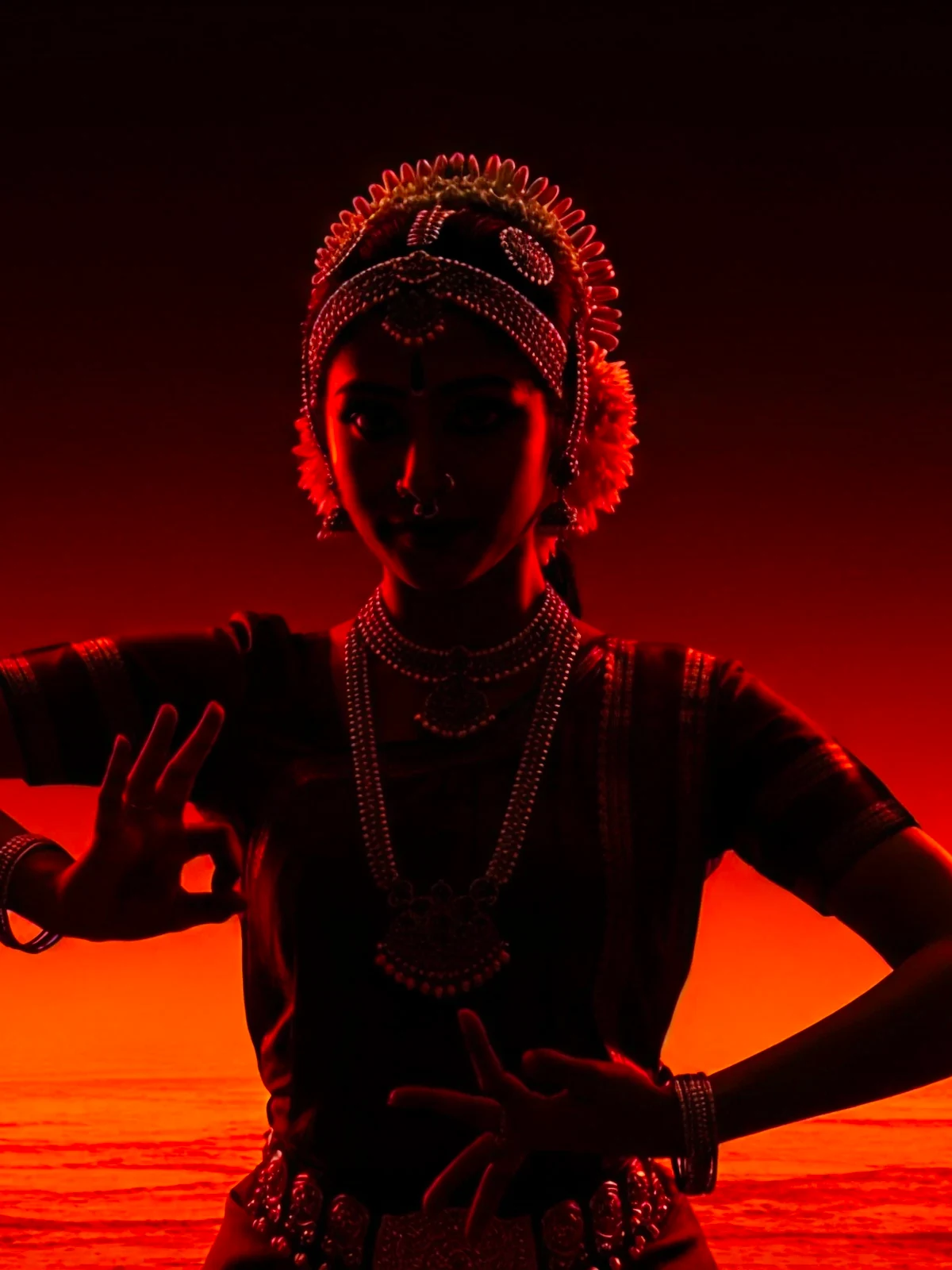 A silhouette of a bharatanatyam