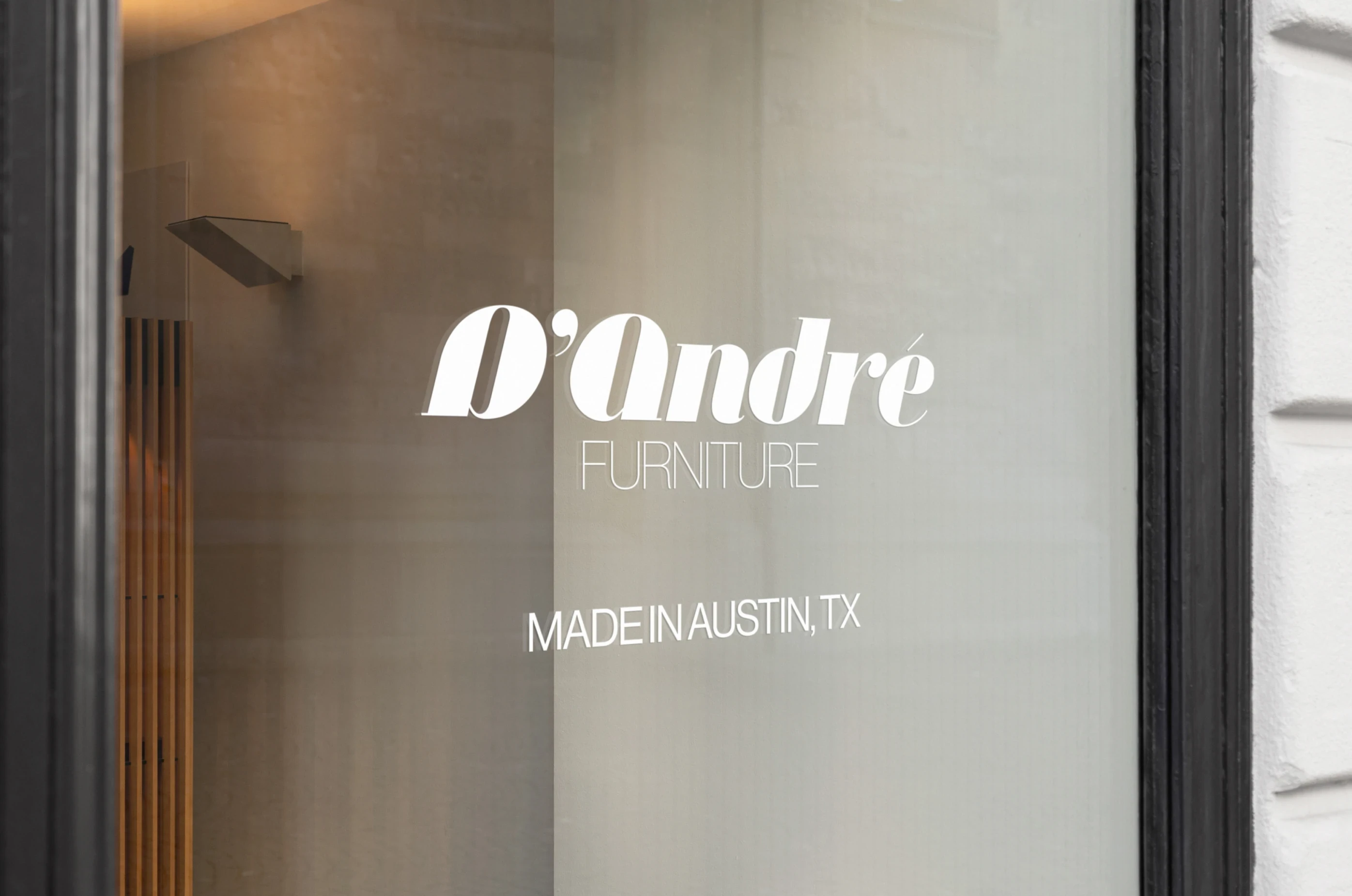 D’Andre Furniture — Logo on glass window signage — Environmental branding