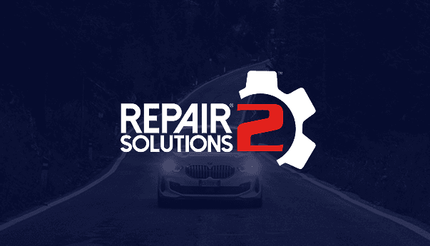 Close-up of a vintage car's front end.