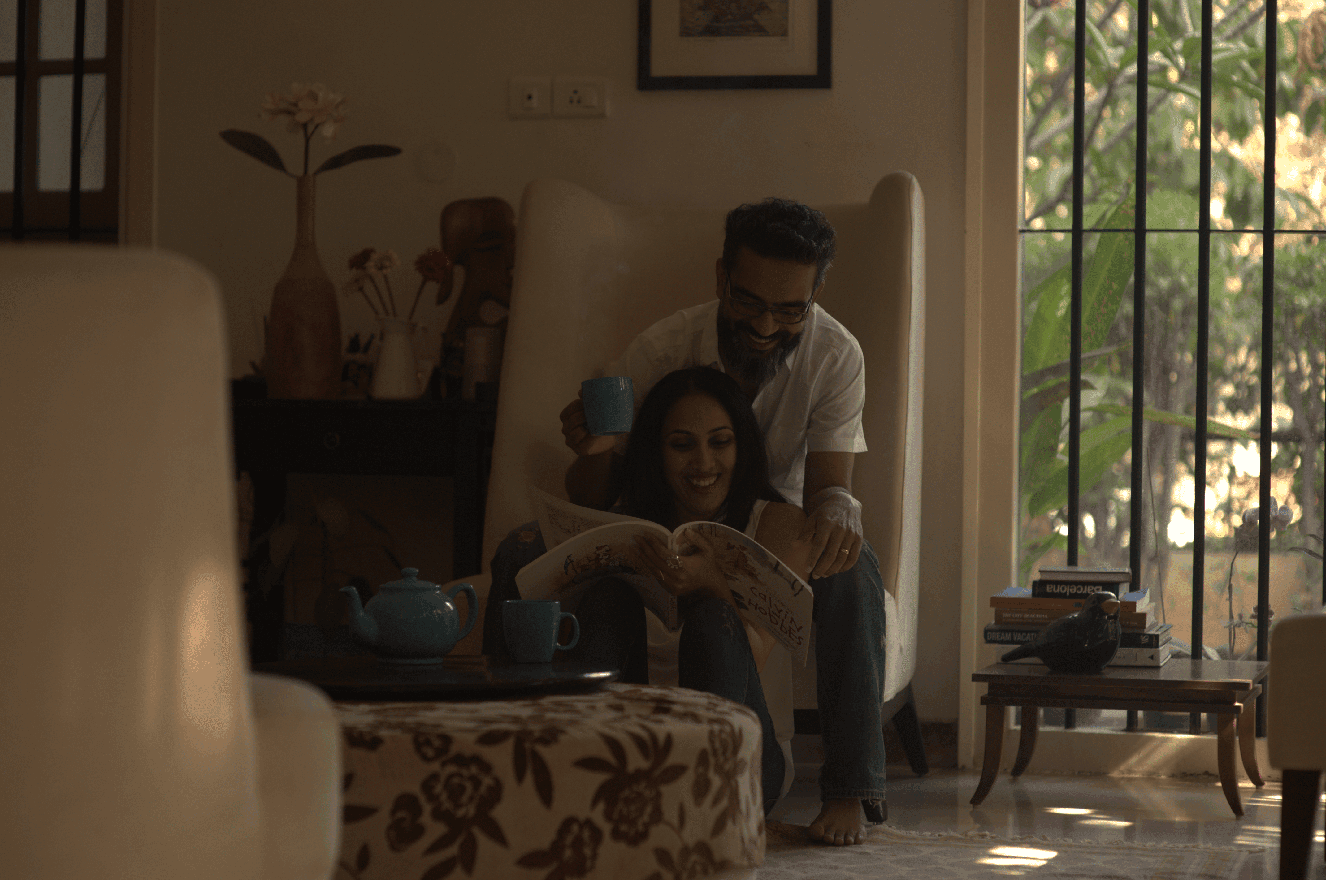 A couple stands closely in an intimate embrace.