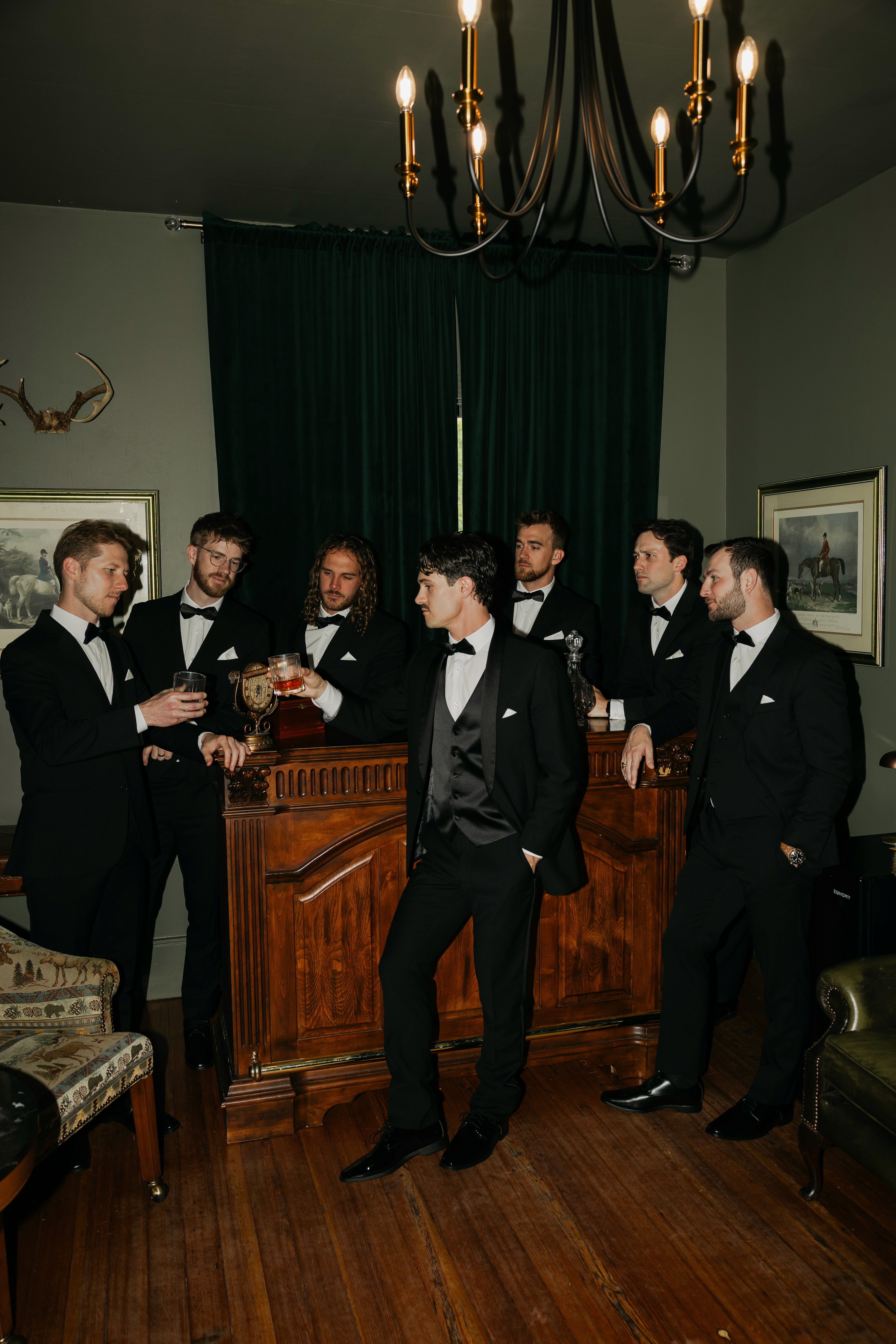     Fort Lauderdale wedding photographer captures groomsmen gathered indoors before the wedding ceremony.