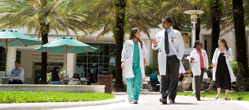 A woman getting her make - up done by a professional make - up artist