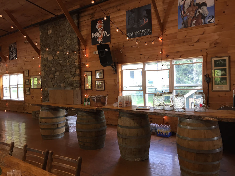 Rustic barrel bar set up in the lodge at Camp Lenox