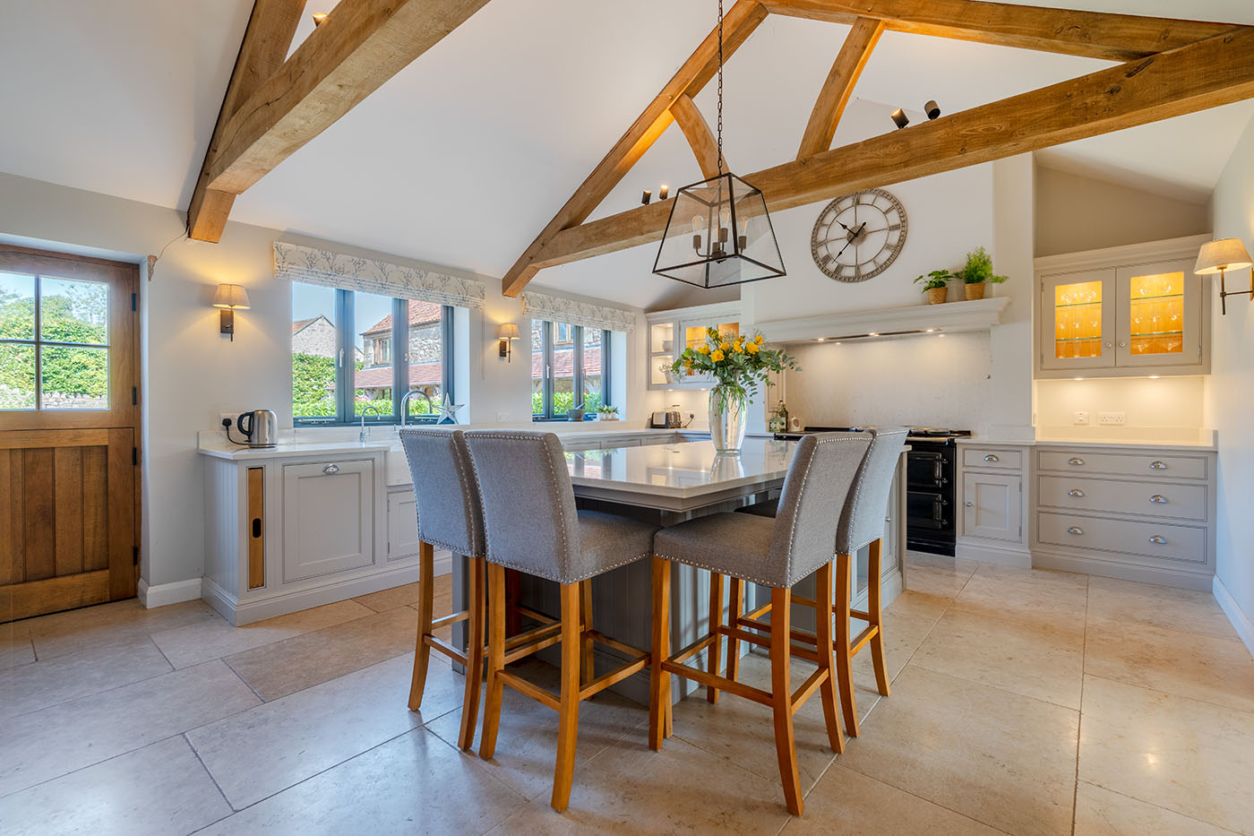 Farmhouse kitchen with beams and central island in Oakhill