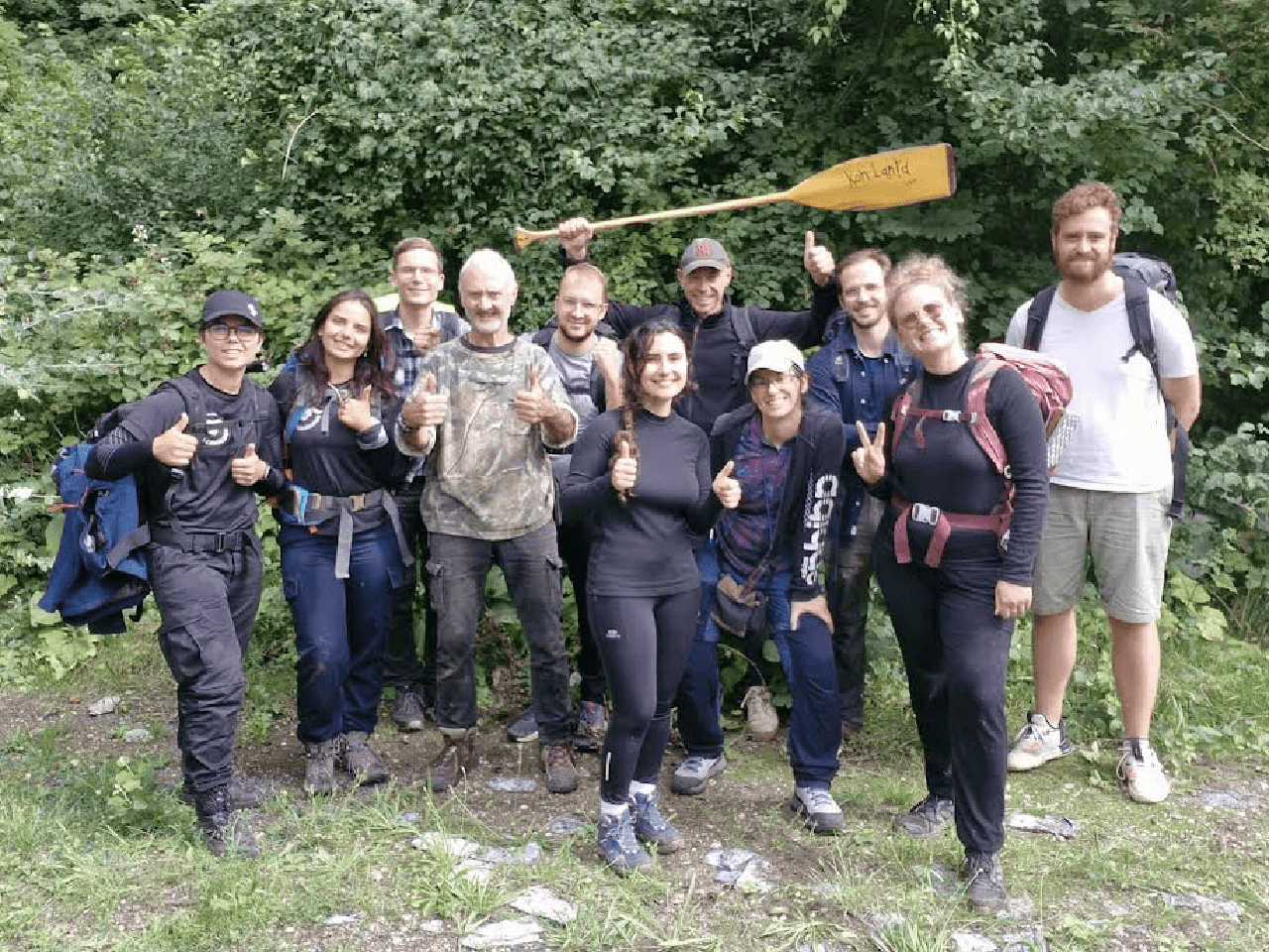 A picture of me and a group of people I spend a week-end surviving with during a surviving course. Everyone look happy and smilling.