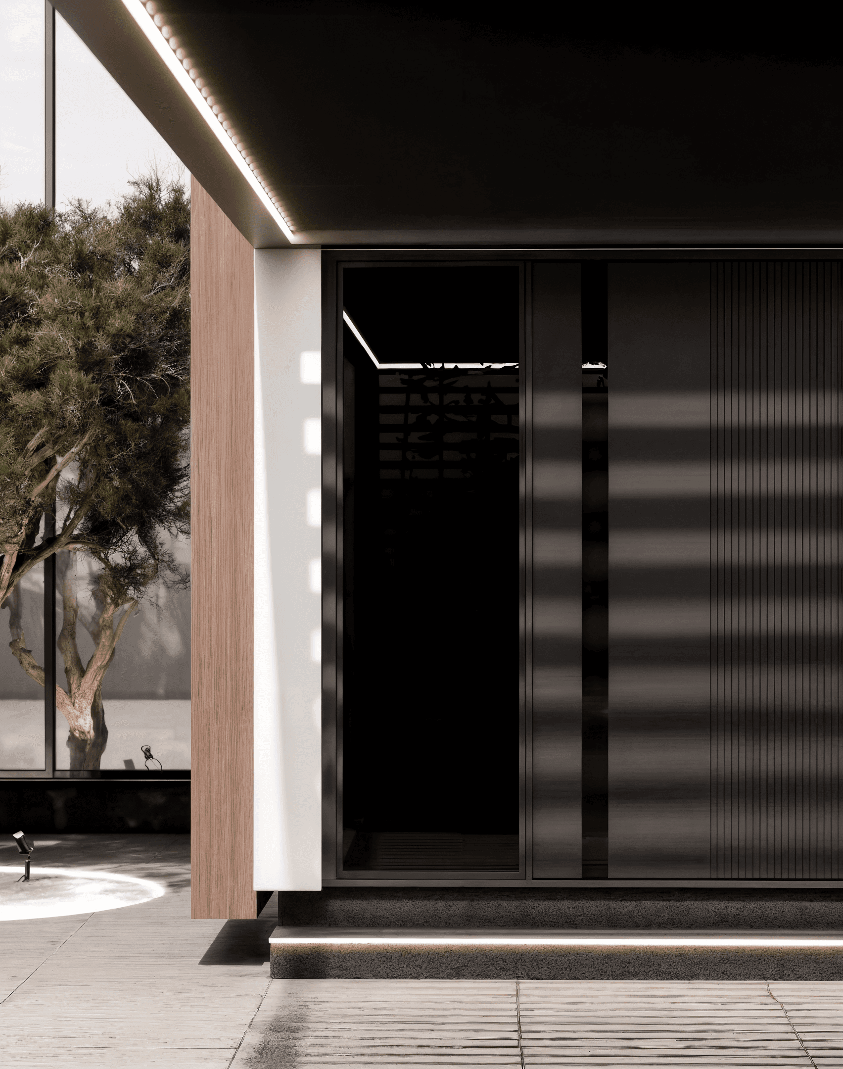 Minimalist living space featuring oak flooring, timber wall panels and panoramic windows with natural light.