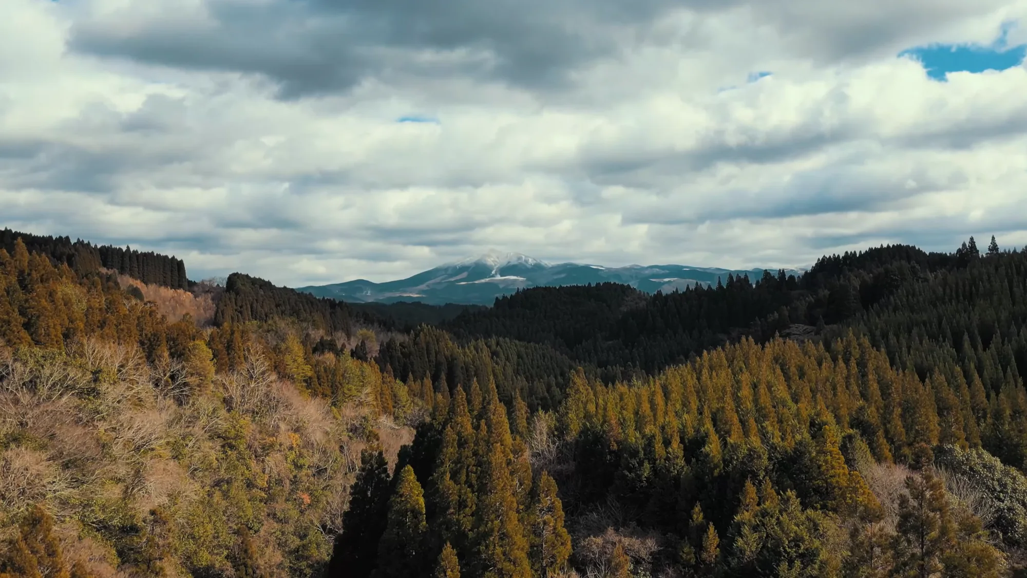 Forested ridges toward the Aso caldera near Kurokawa