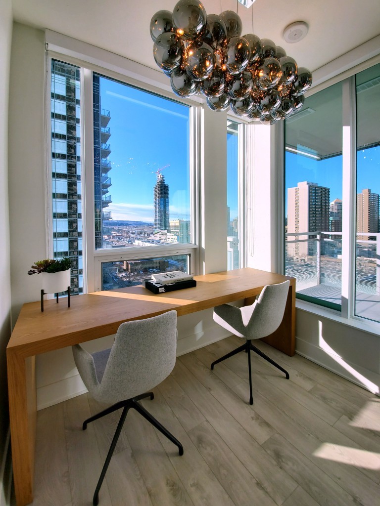 Image of Modern home office with city view featuring KHD Homes interior design and luxurious furniture layout.