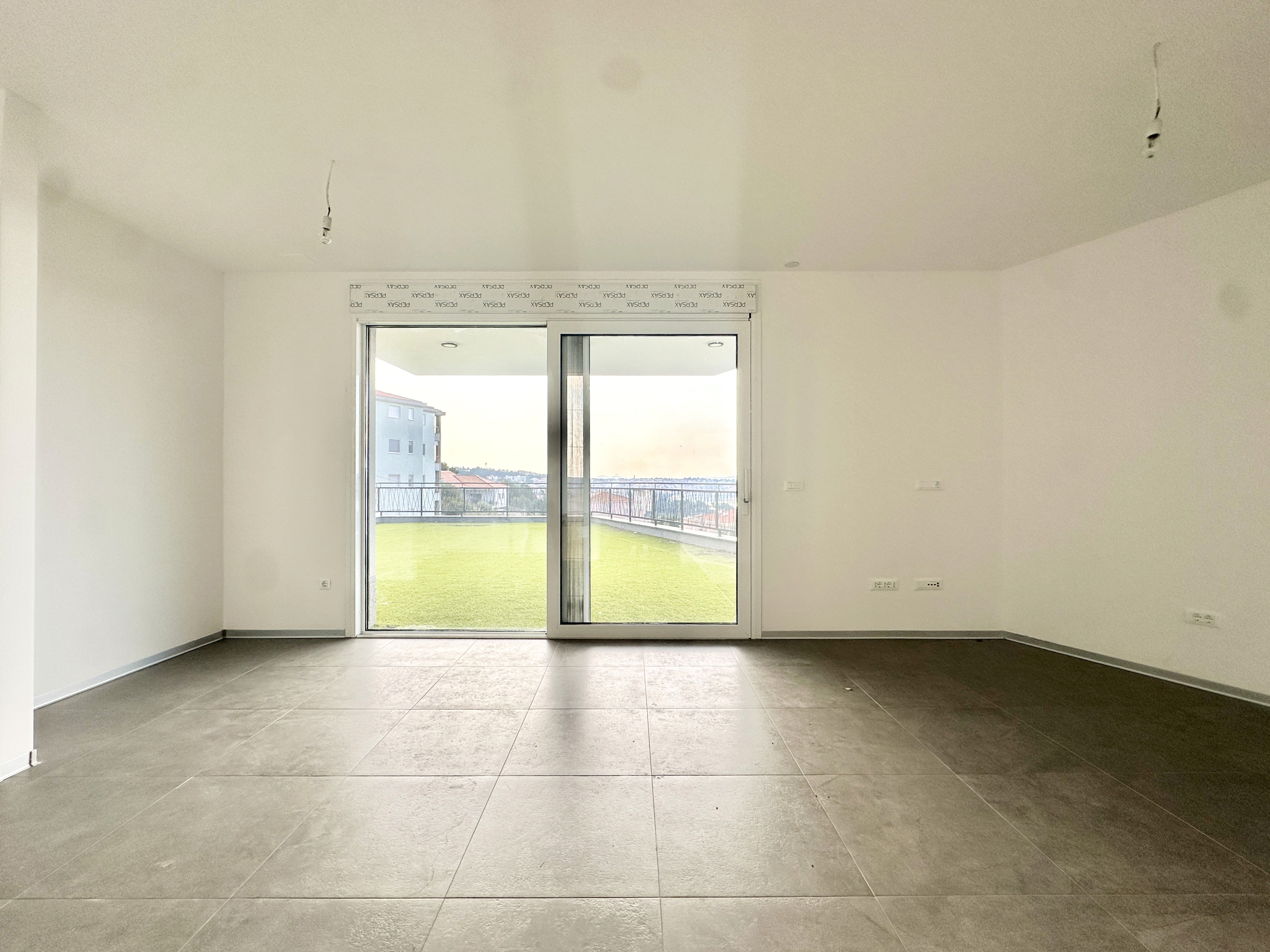 Large modern interior space with concrete walls