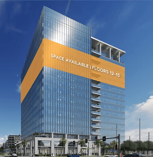 Exterior view of Midtown East Office Tower building facade showing modern office tower with accent lighting