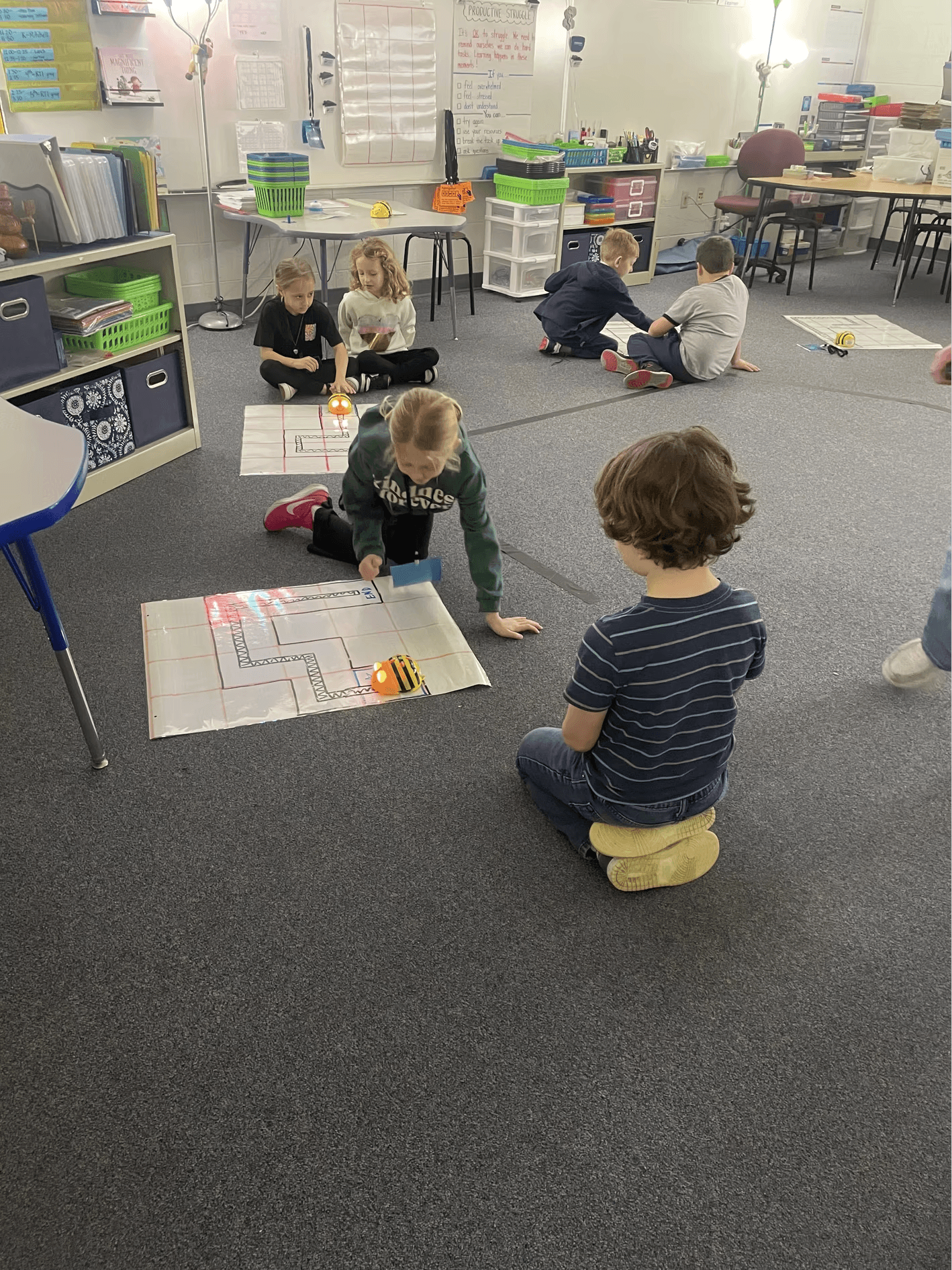 Students working on a project on the floor at Allen Elementary School.