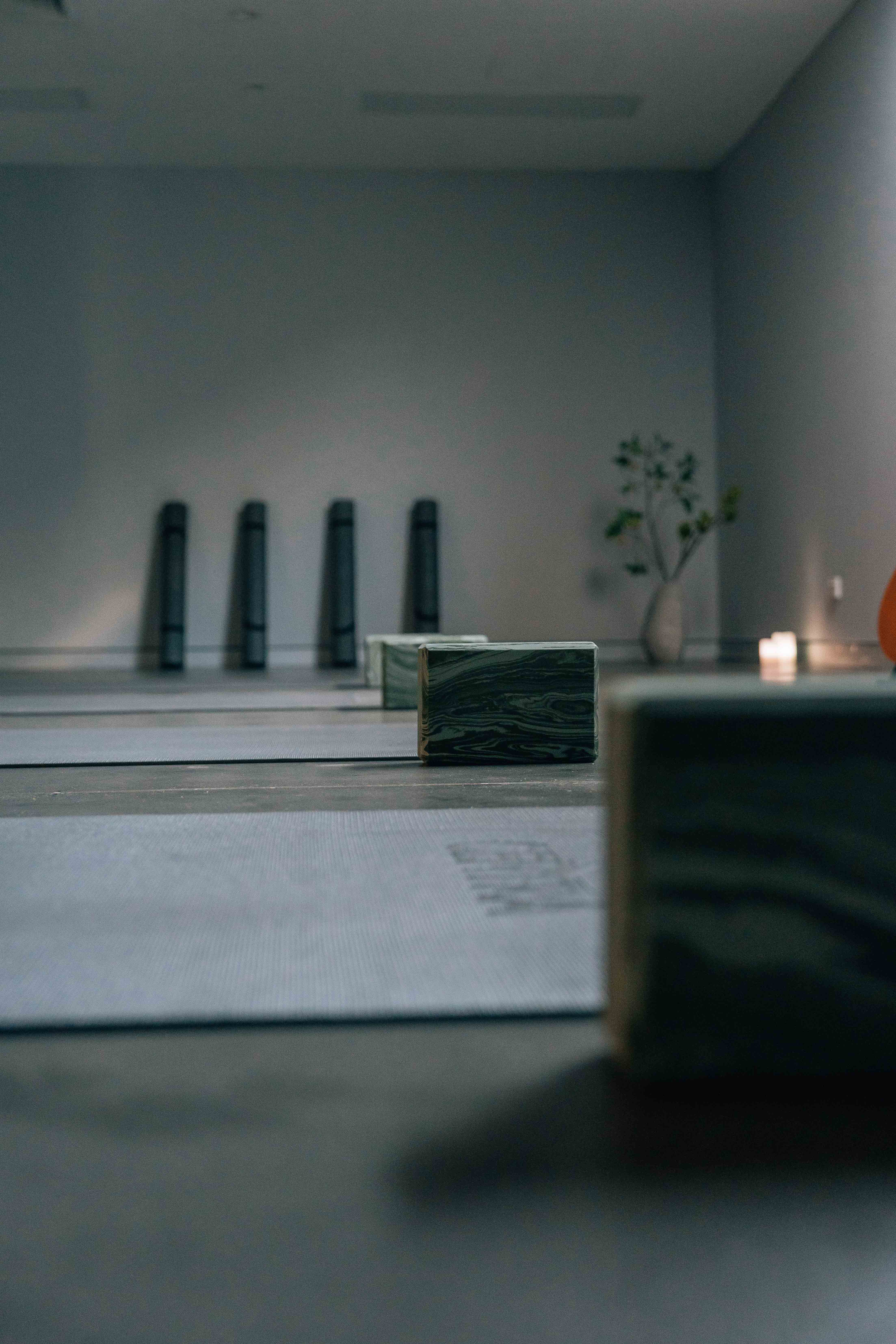 clean-pill Silhouette of a person meditating at sunset, with warm light and tropical plants in the background.