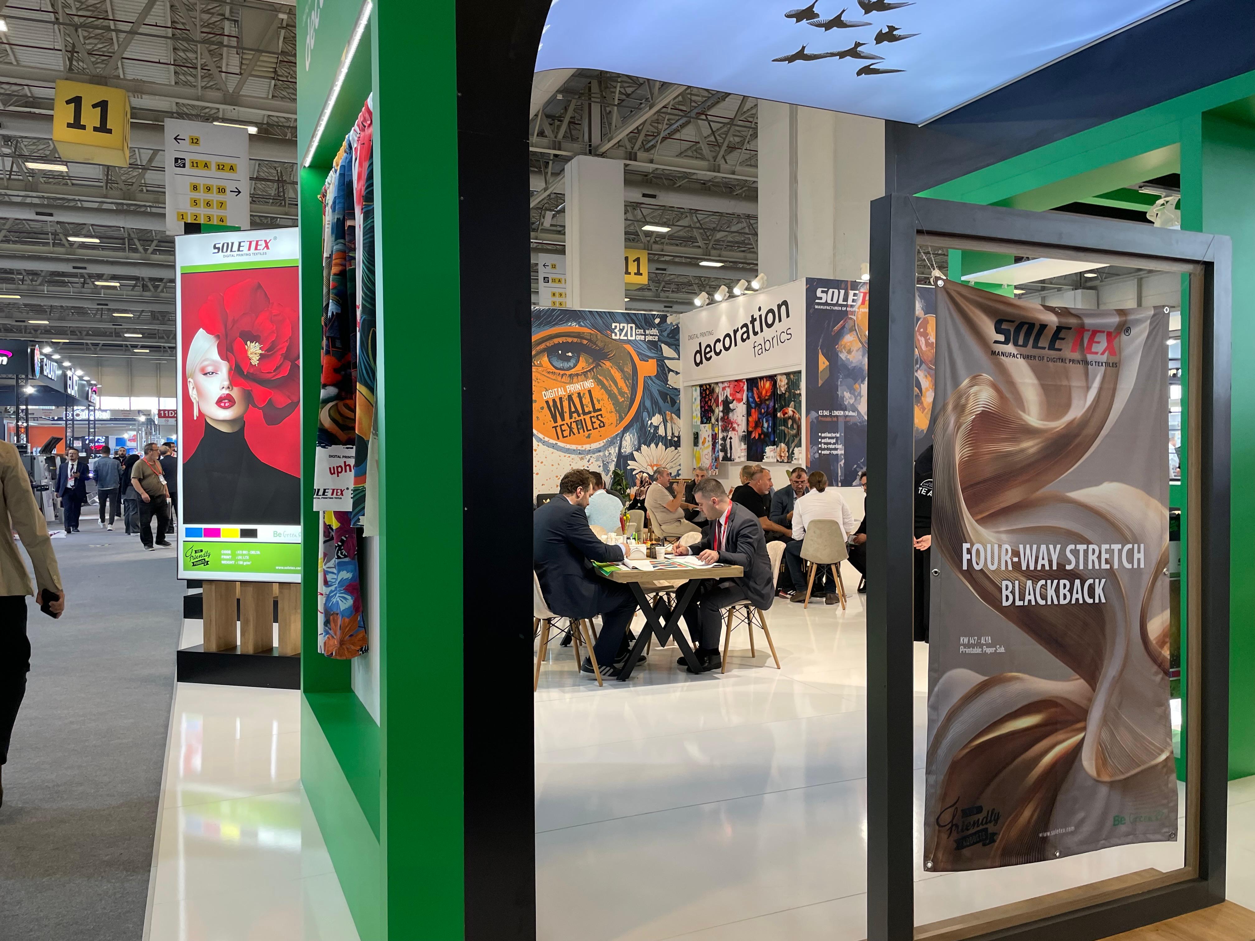 Product sample and fabric display zones at the SOLETEX stand, showcasing wall textiles, decoration fabrics, and digital printing materials.