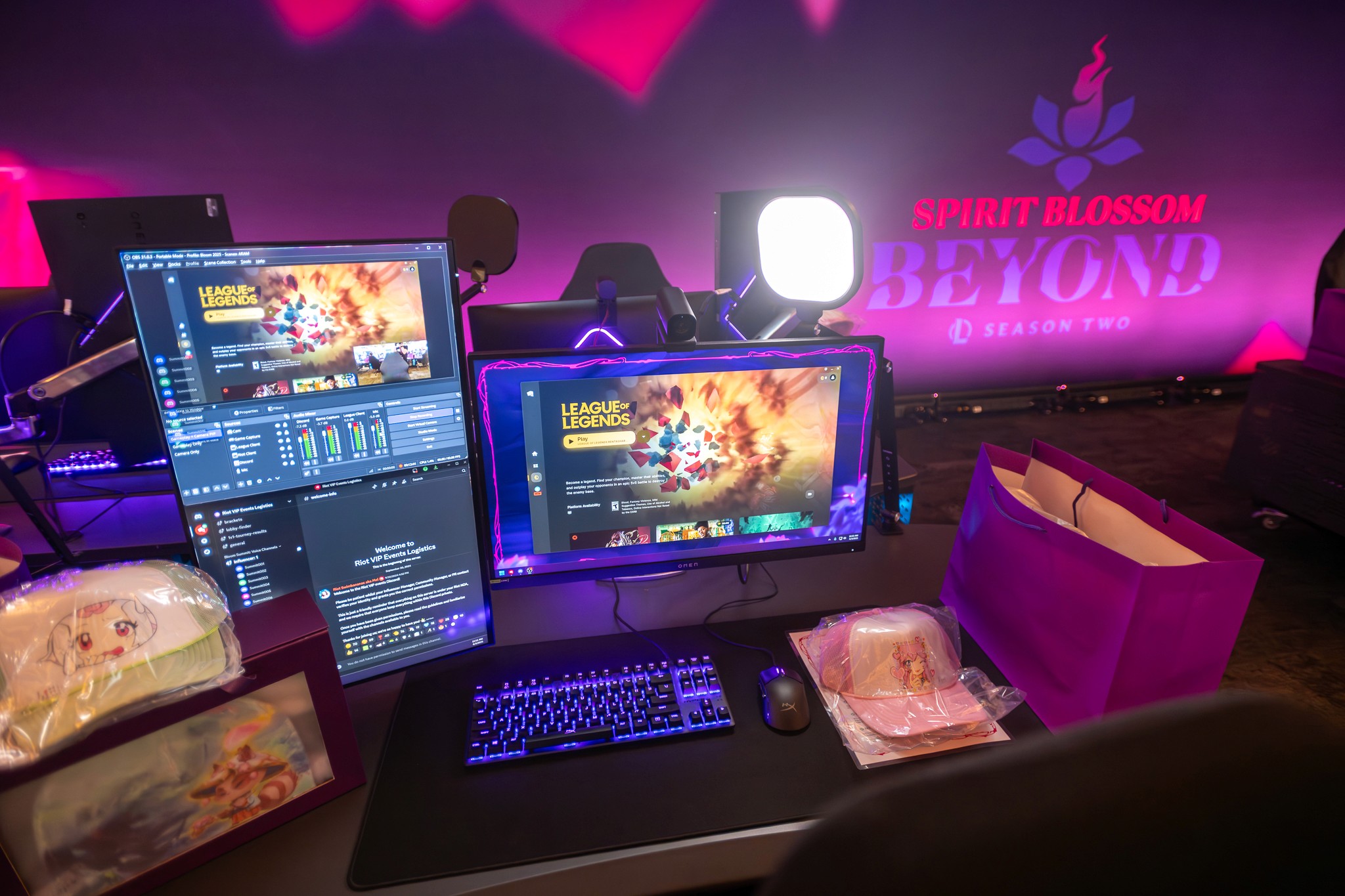An influencer focused on playing League of Legends at a high-end gaming station.