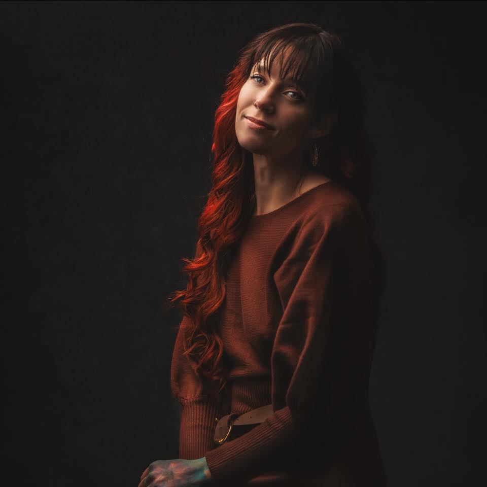 Close Up Photo of Woman Wearing Eyeglasses