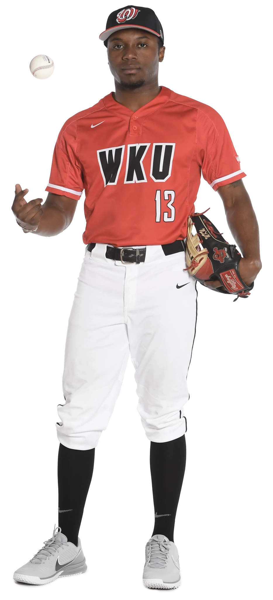 Junior Coleman posing in a red baseball jersey