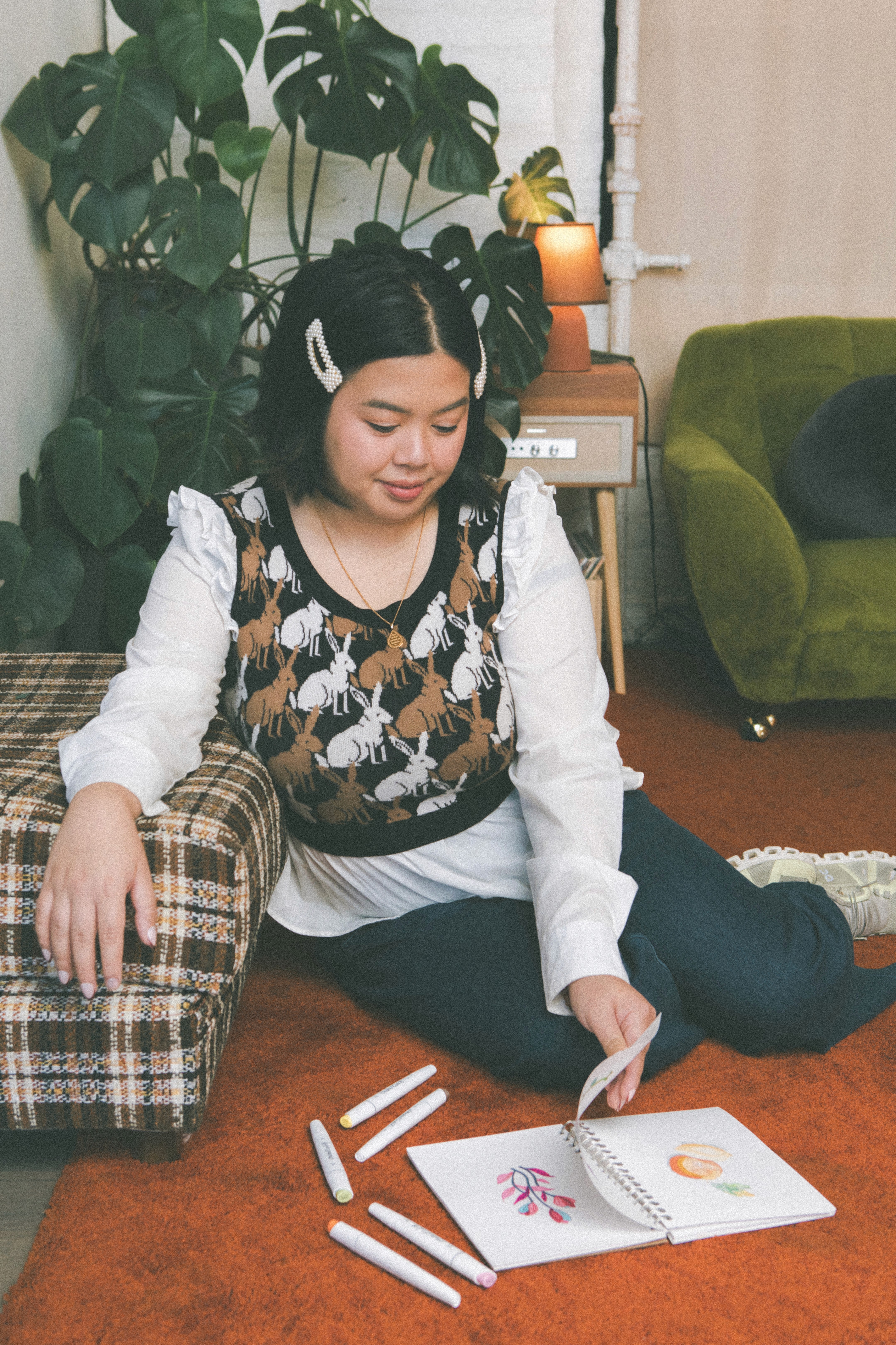 designer flipping through sketchbook