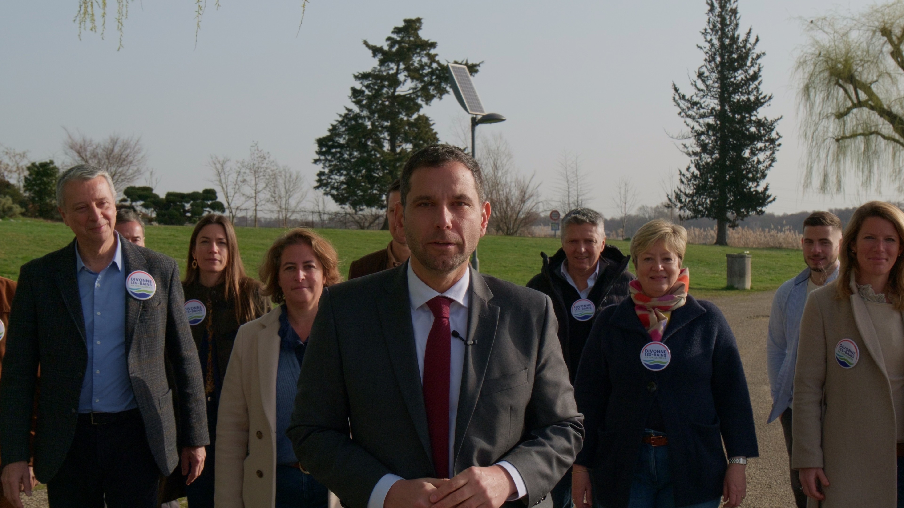 Modern living room with large modular sofa and television.