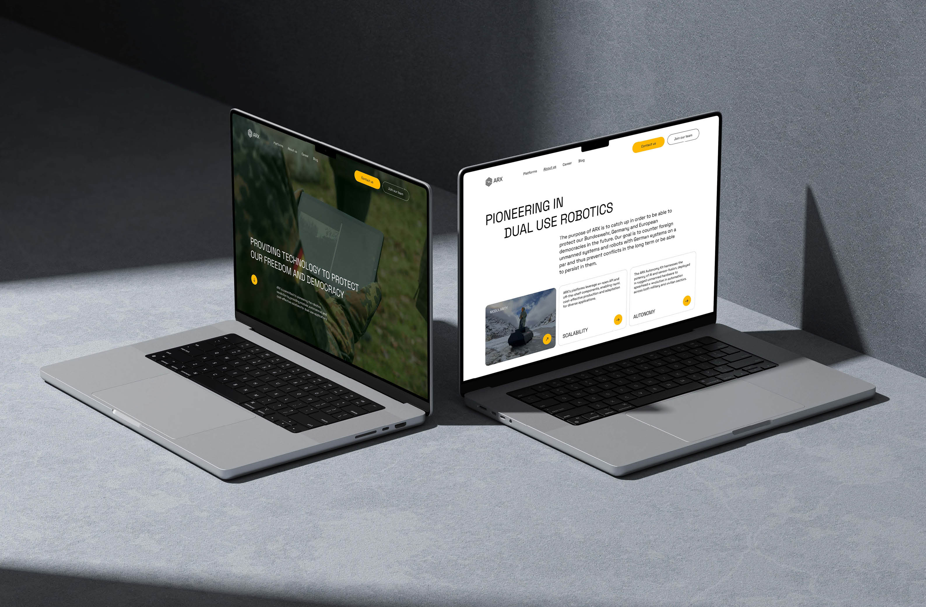 Two laptops displaying websites focused on dual-use robotics and technology for democracy.