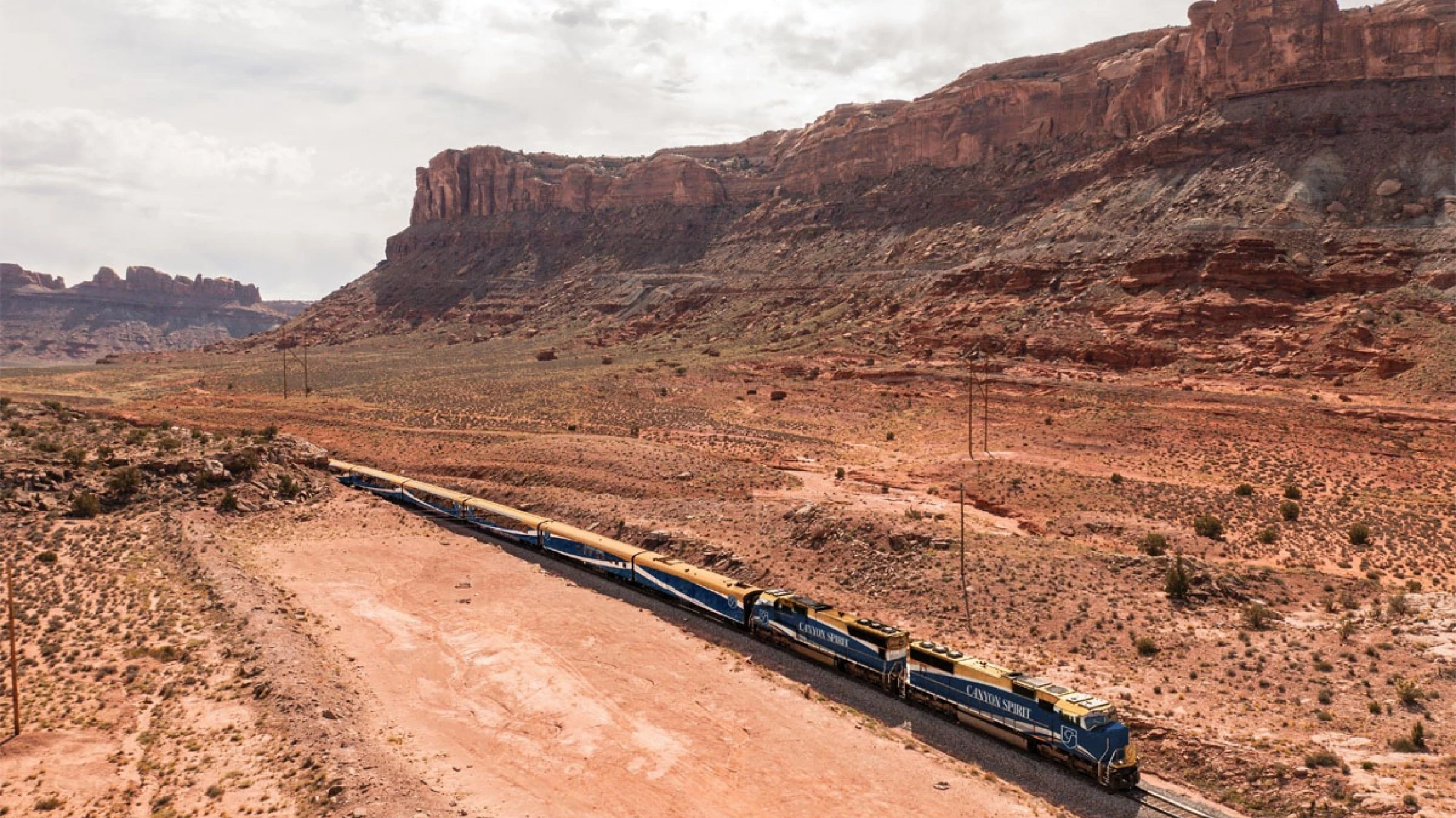 The Canyon Spirit train passing through Red Canyon on the Rockies to the Red Rocks route