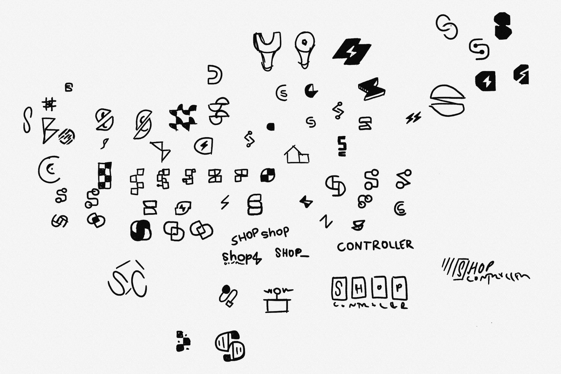 A collection of various logos and symbols, including a prominent "S" symbol, are displayed in a black and white format. The logos are arranged in a somewhat random manner, creating a visually interesting and diverse display.