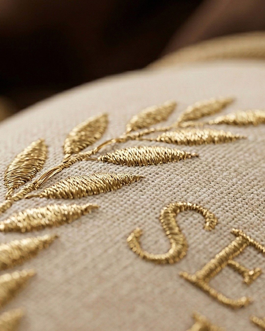 Terracotta workspace with custom wooden desk, warm plaster walls, natural light, and abstract wall art.