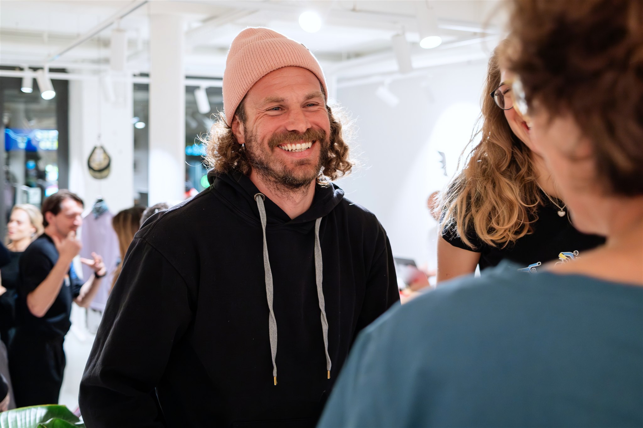 Guest smiling during conversation at product launch in Zurich