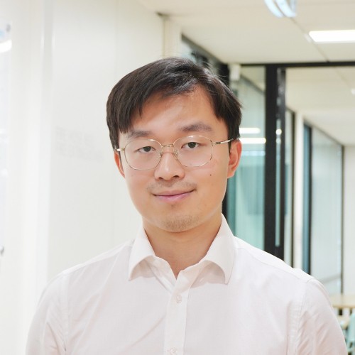 smiling woman wearing white and black pinstriped collared top