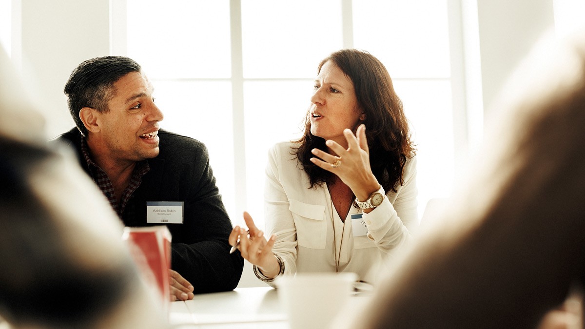 A group of people sitting around a table during a workshop