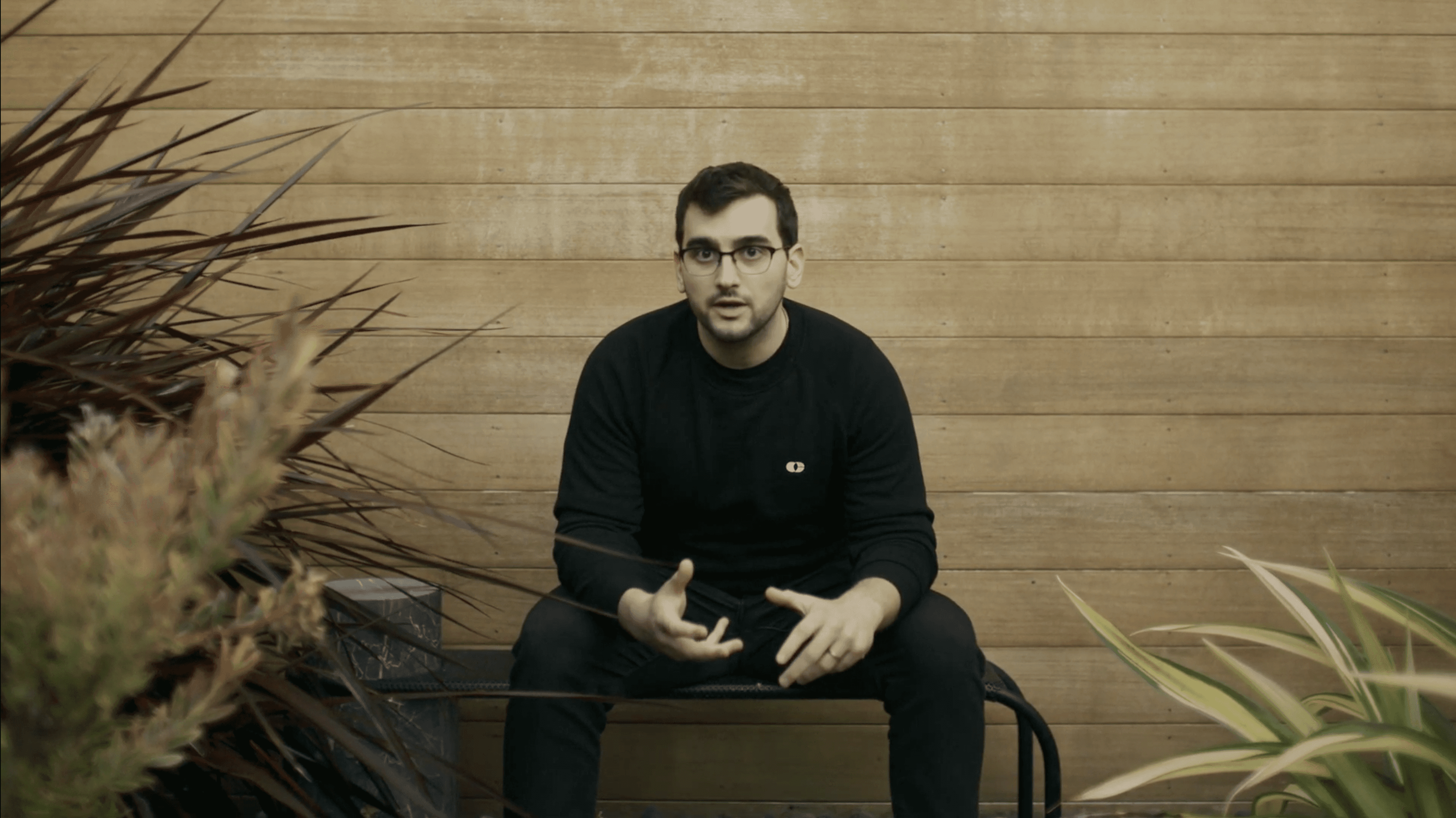 two women sitting on chair