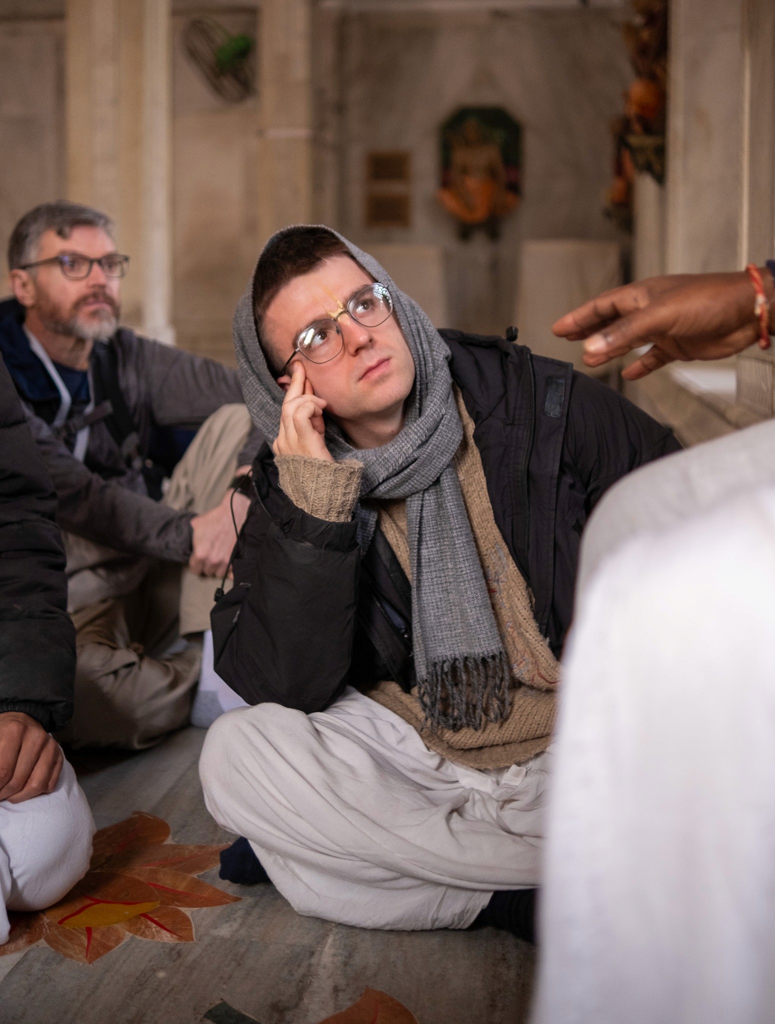 A man stading with Surfboard