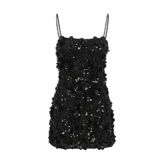 A sleek, modern black and silver camera with a large APO-Summicron lens, highlighted with a small red circle button, rests against a dark background.