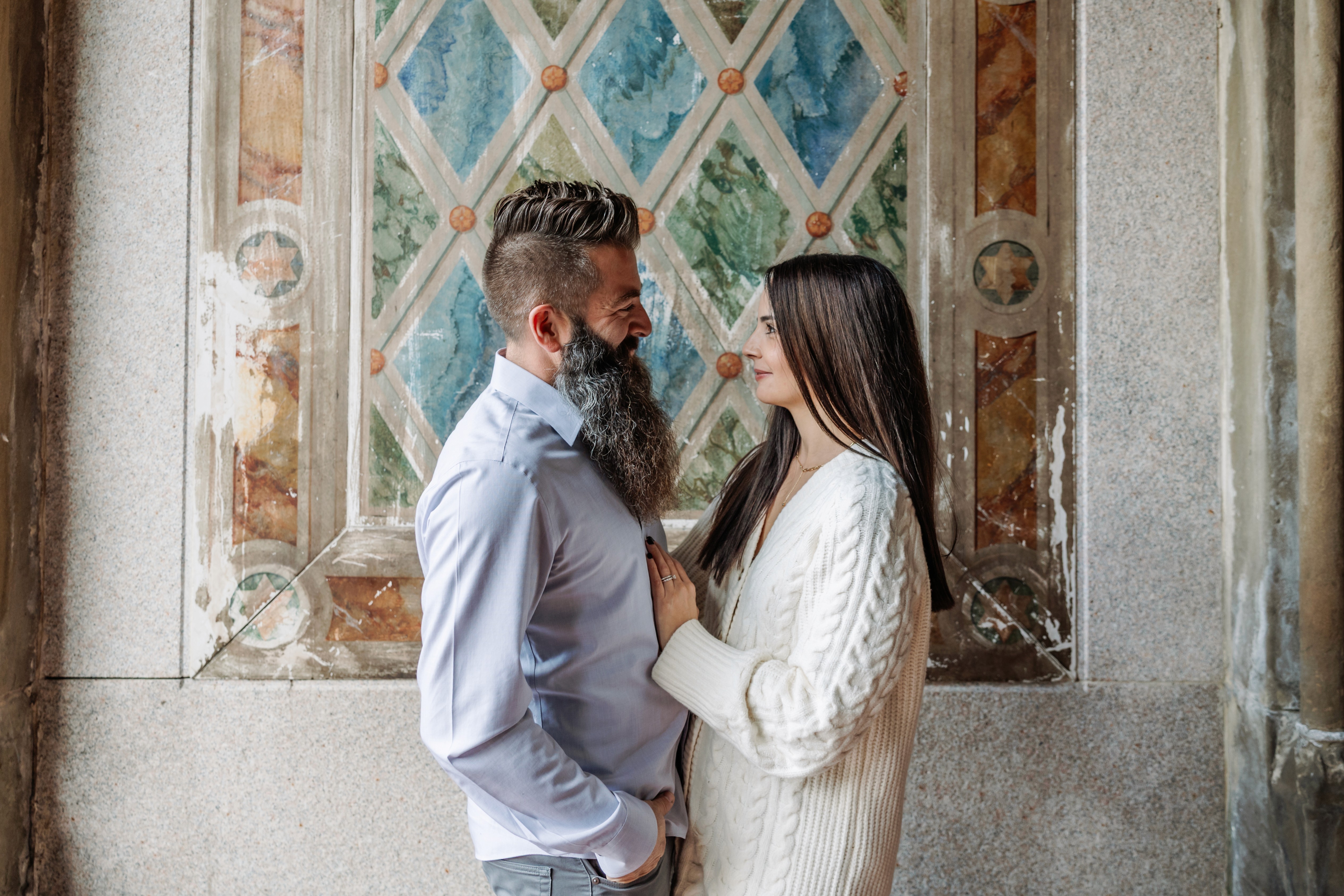 Couple caught in a genuine laugh on the stairs at Bethesda Fountain in Central Park, NYC — fun, unposed couples photography by Lizz Spano Photography, New York City couples photographer.