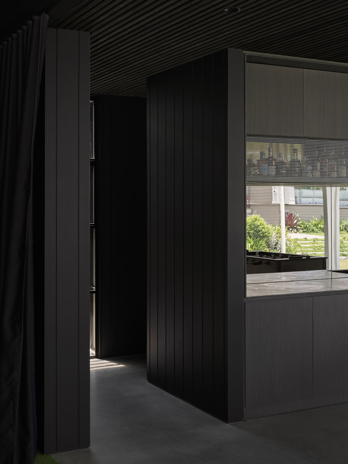 bar area with dark timber joinery and built-in cabinetry