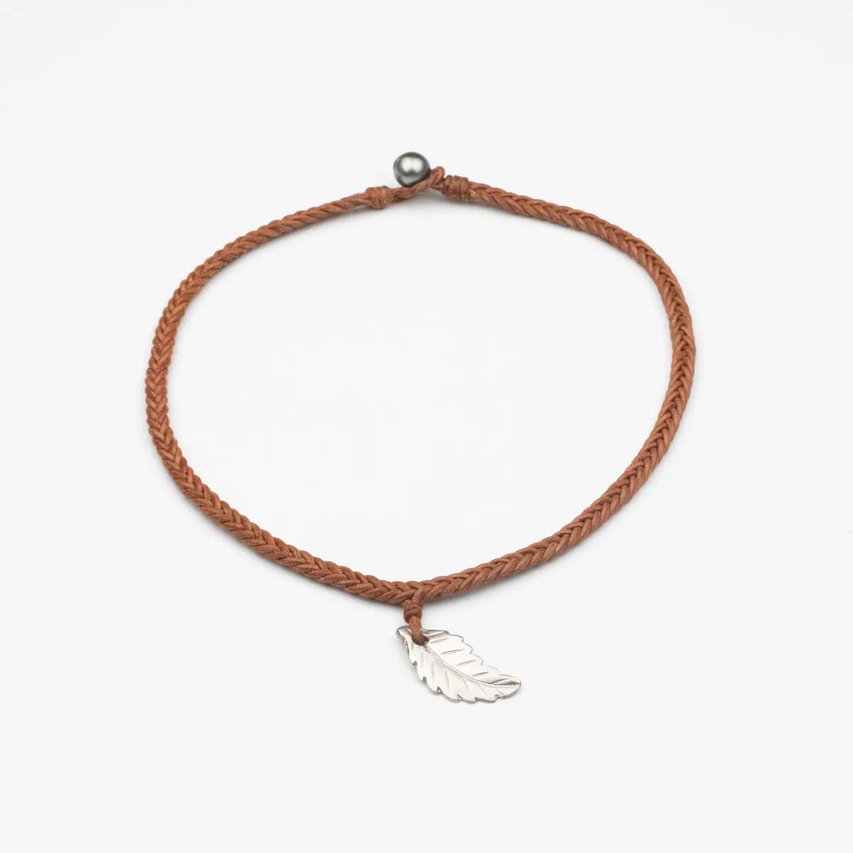 Silver feather pendant with round Tahitian Pearl on terracotta braided leather choker necklace — Manos de Oro Saint Barth