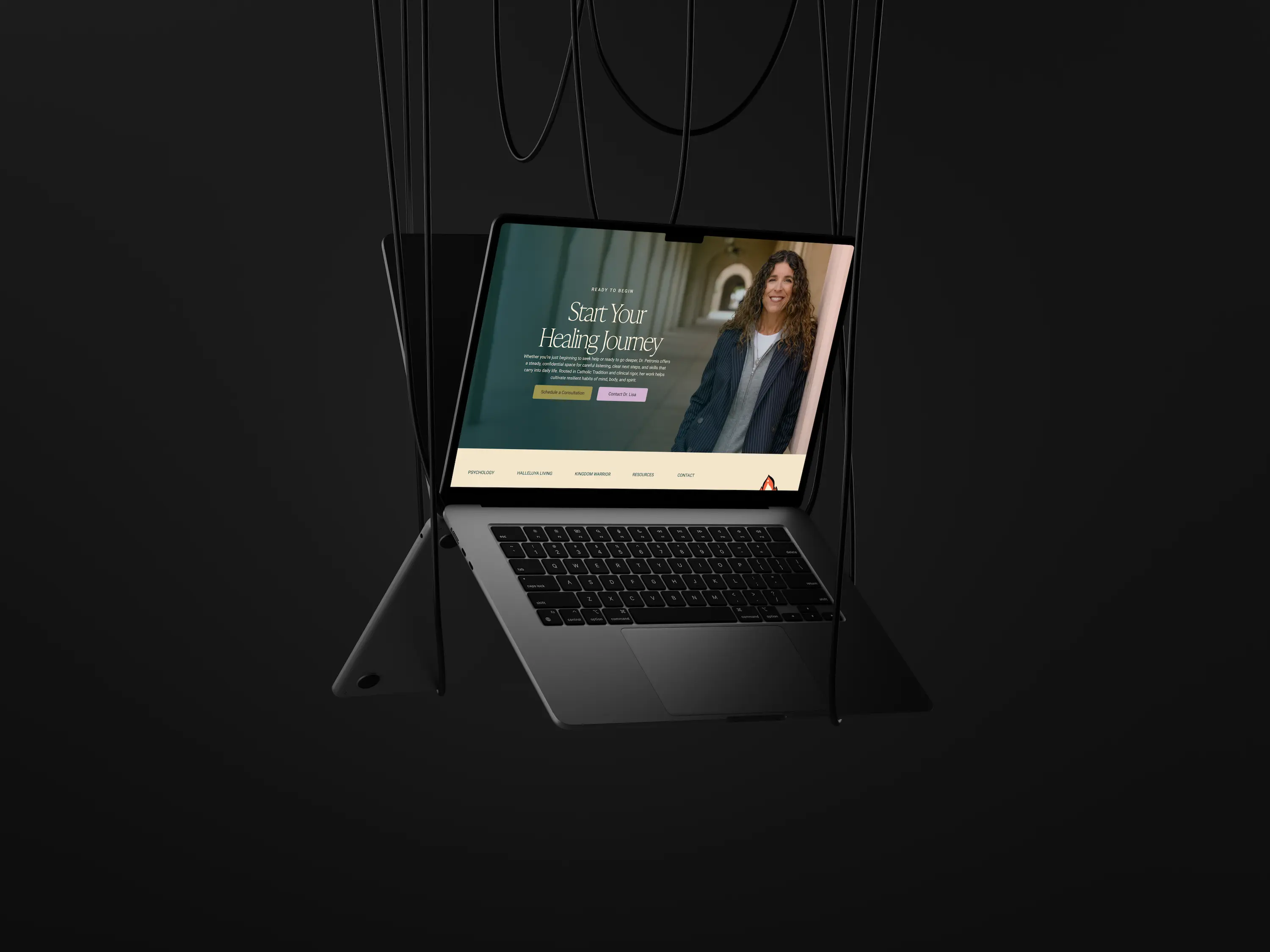 A laptop is displayed on a dark background, showing a presentation or content on the screen for Dr. Lisa Petronis website.