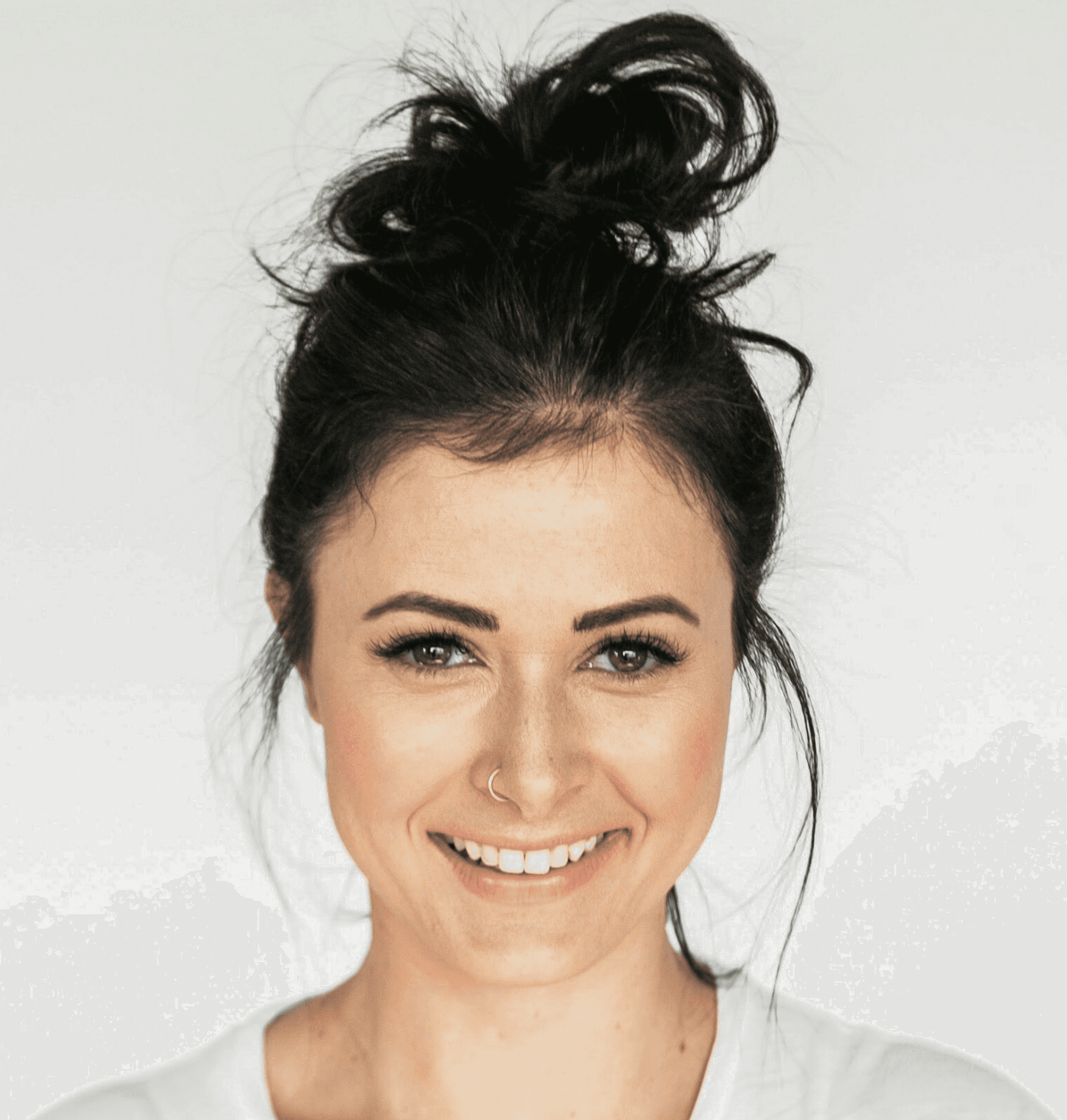 woman in white crew neck shirt smiling