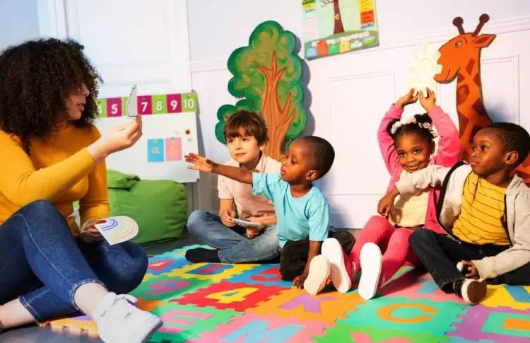 Nursery students with their teacher