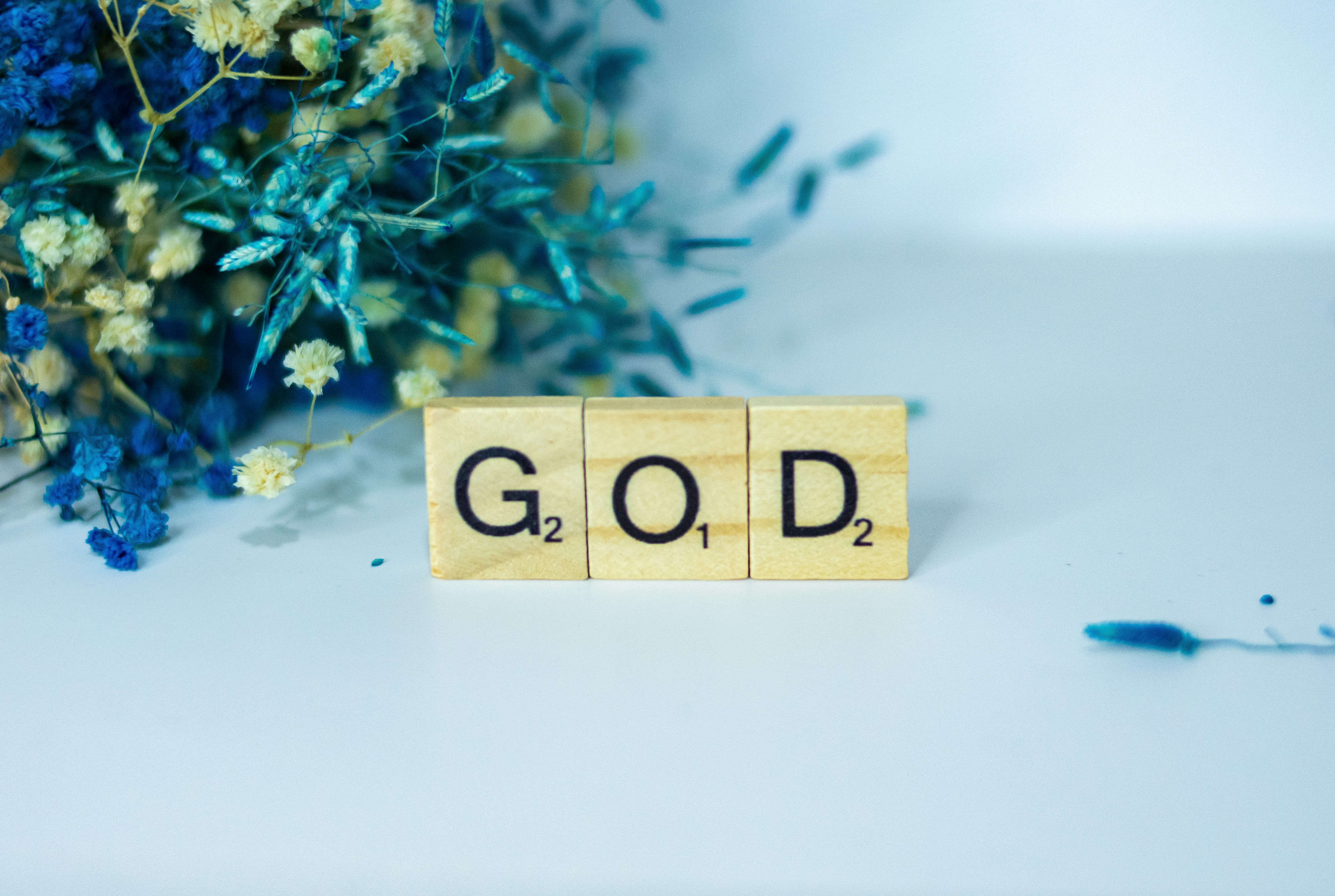 a wooden block with the word god written on it