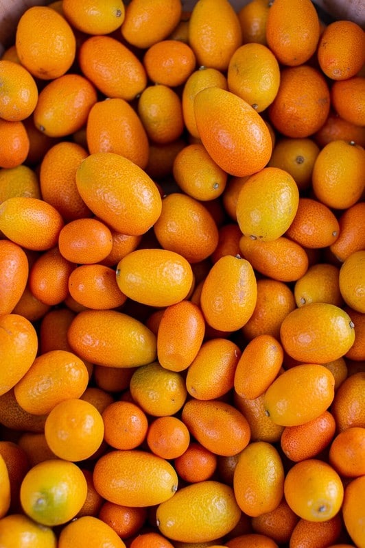 two people looking at a tablet and smiling