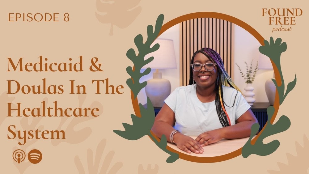 The Office – EPISODE 8: Medicaid & Doulas In The Healthcare System “A woman seated in a relaxed setting, featured in Episode 8 titled ‘Medicaid & Doulas In The Healthcare System,’ with ‘FOUND FREE’ text in the corner—recorded in The Office.”