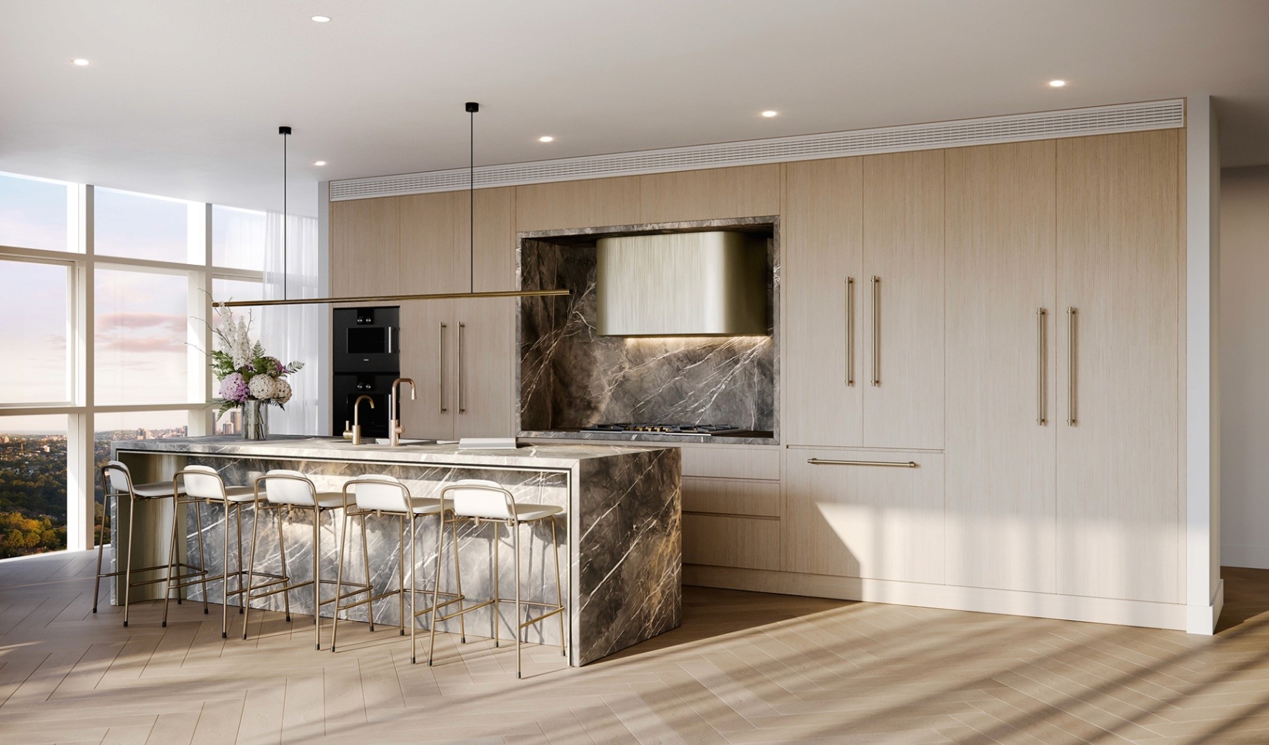 Designer kitchen at Hammond Greens showcasing marble island bench, integrated appliances and luxury finishes in a high-end apartment interior.