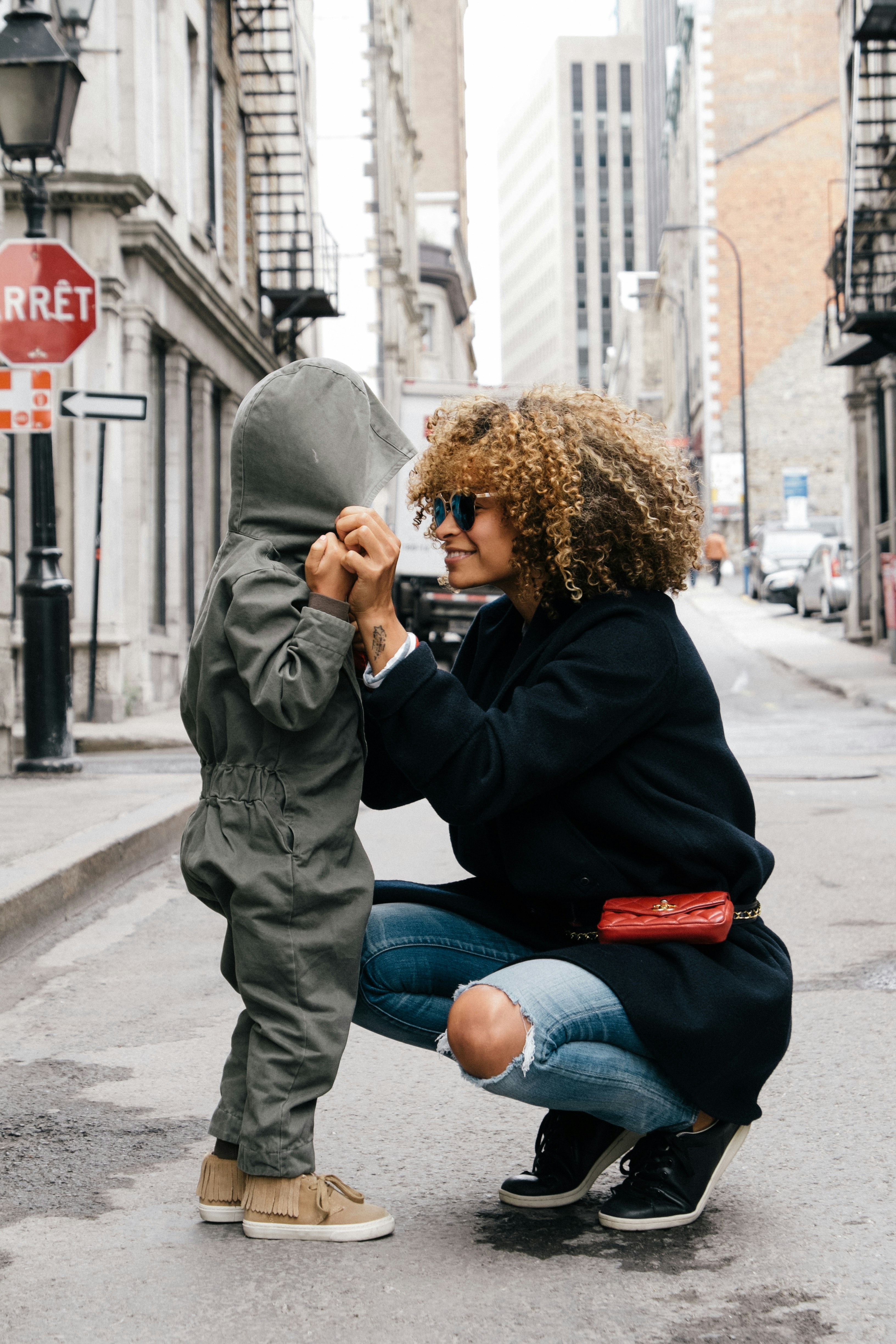 Parent getting down to child's level and looking them in the eyes