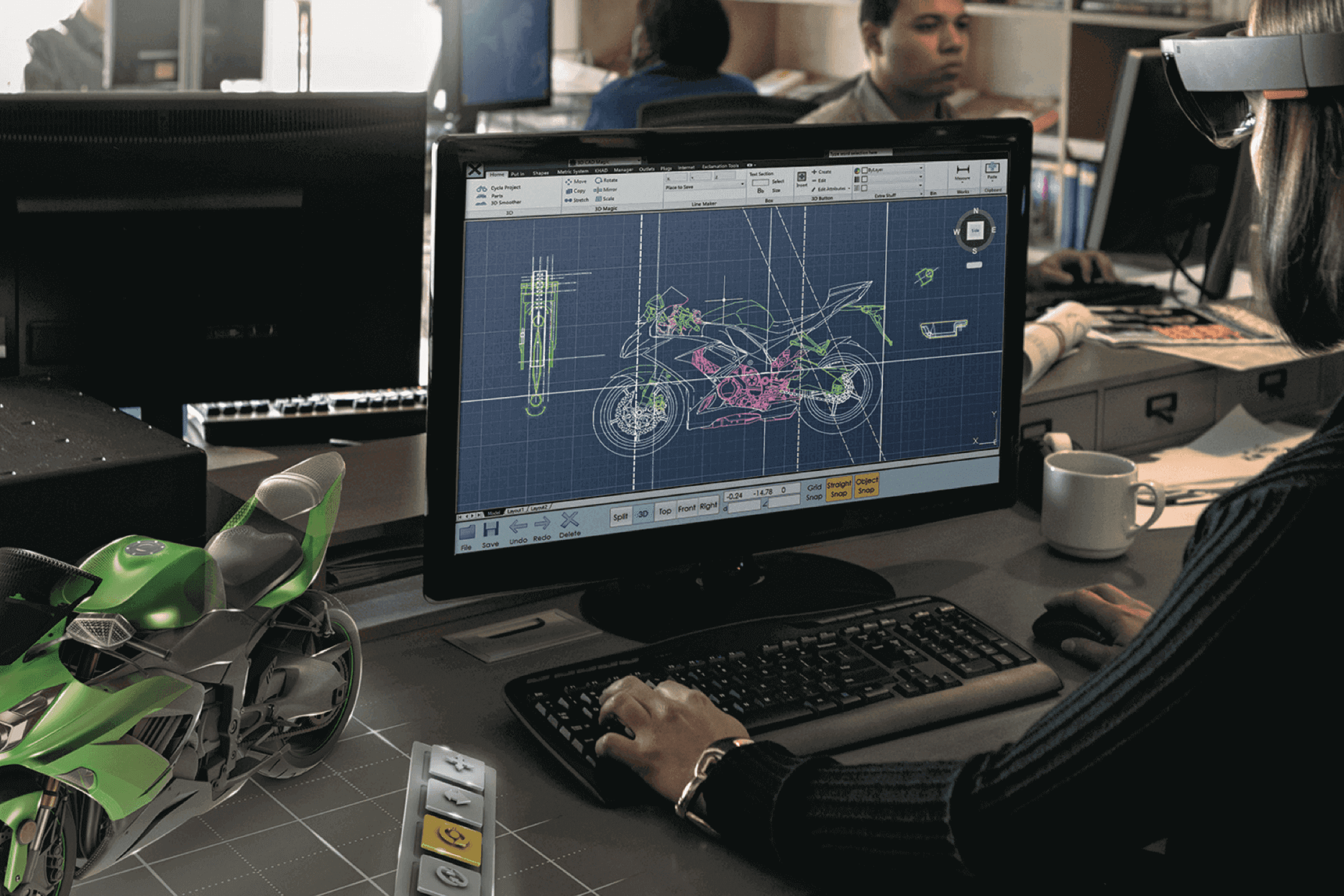 A person working in front of a laptop using AR application