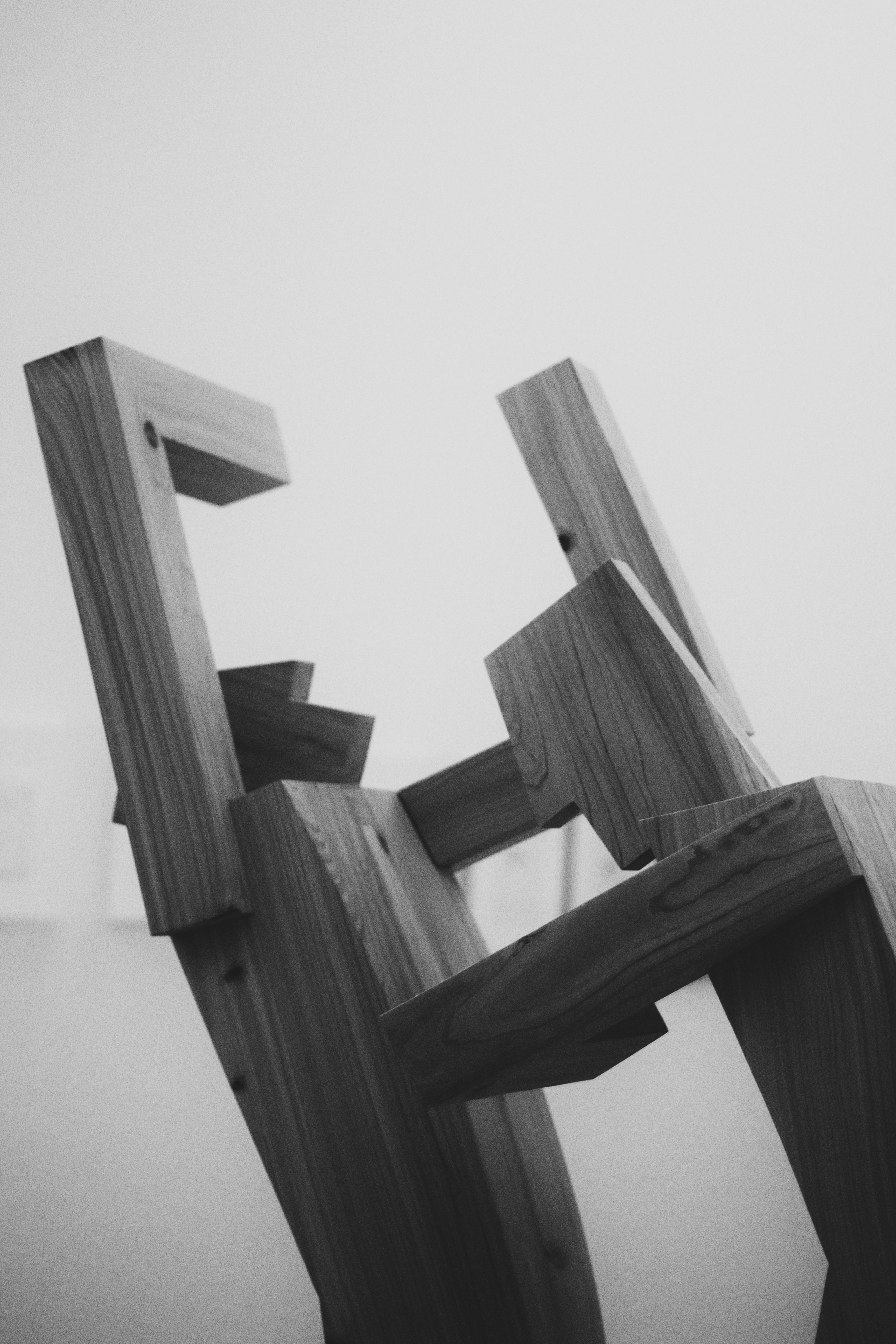 A black and white photo of a wooden sculpture