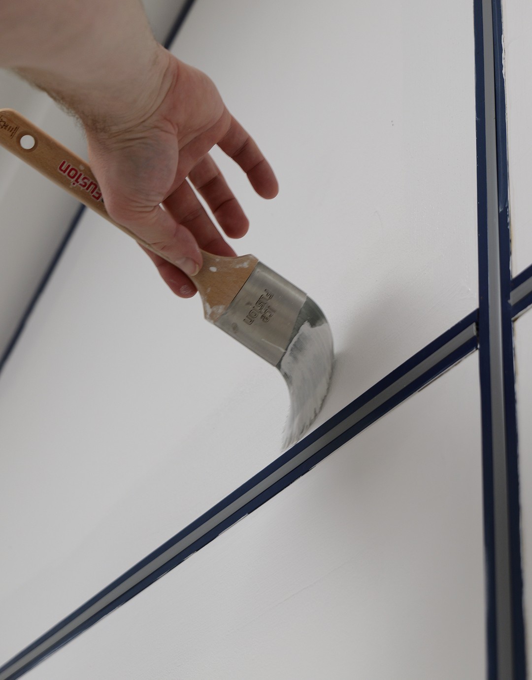 Ladder in the centre of the room with paint backets and tool around it