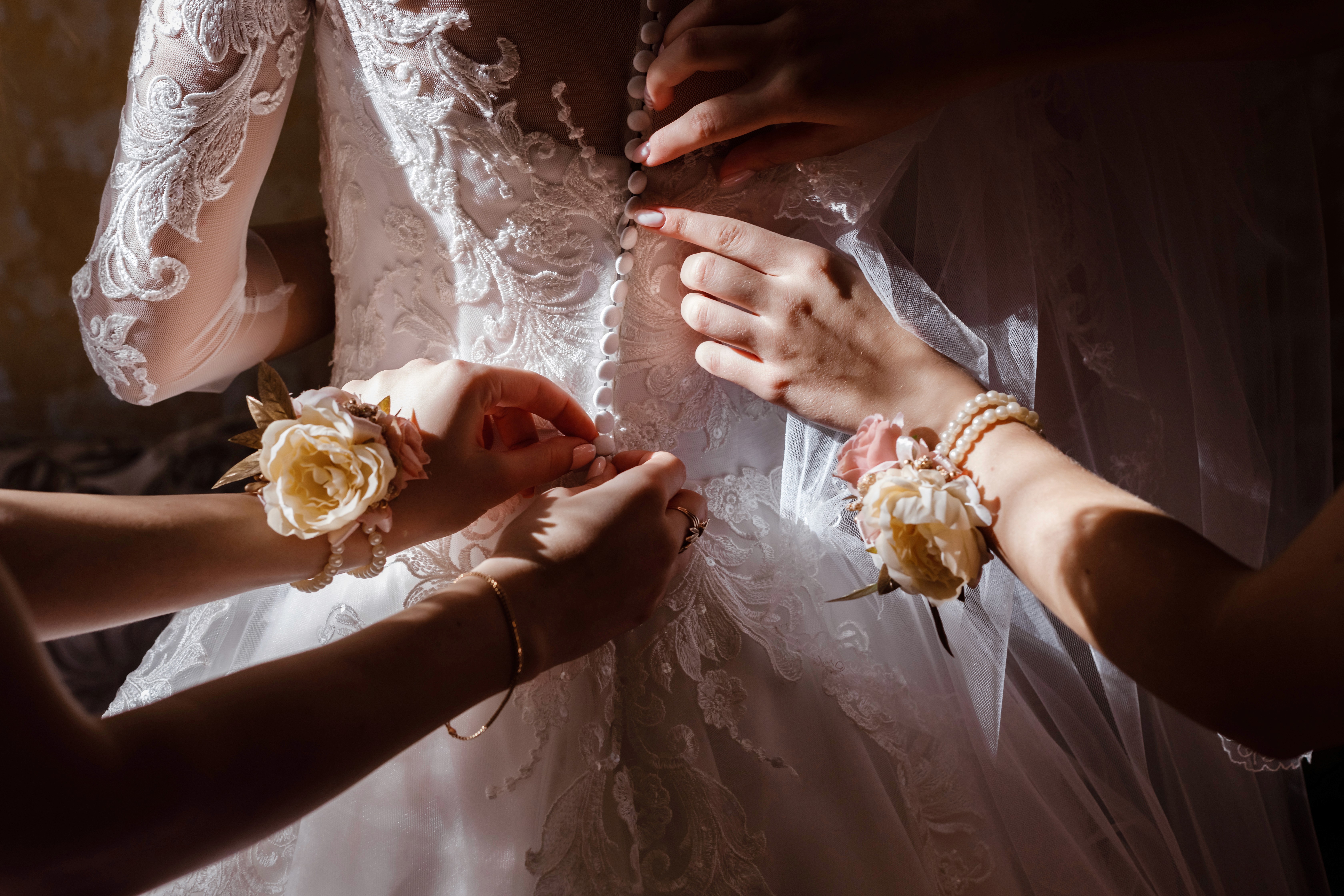 Bride holding a bouquet during a destination wedding ceremony, captured in a timeless black and white moment