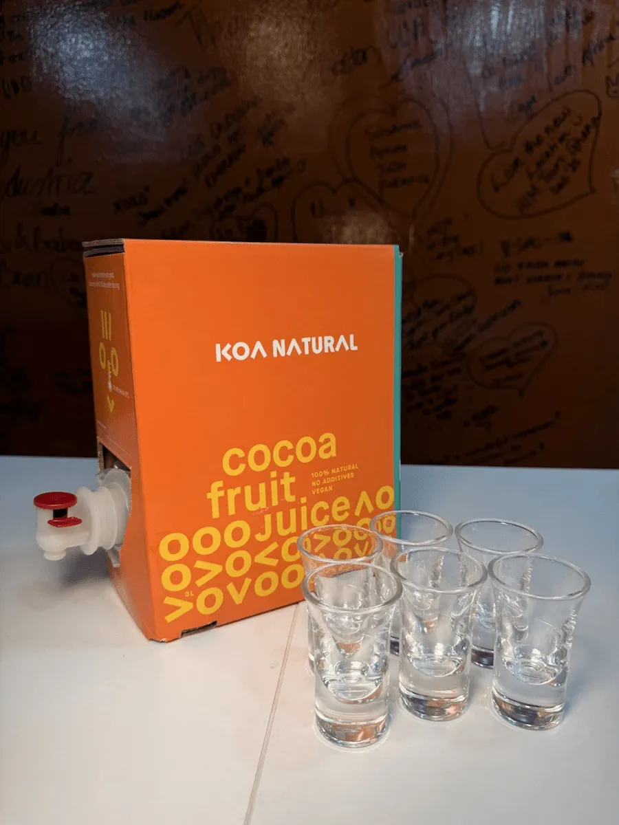 Glasses of Koa Natural cocoa fruit juice ready for a tasting session.