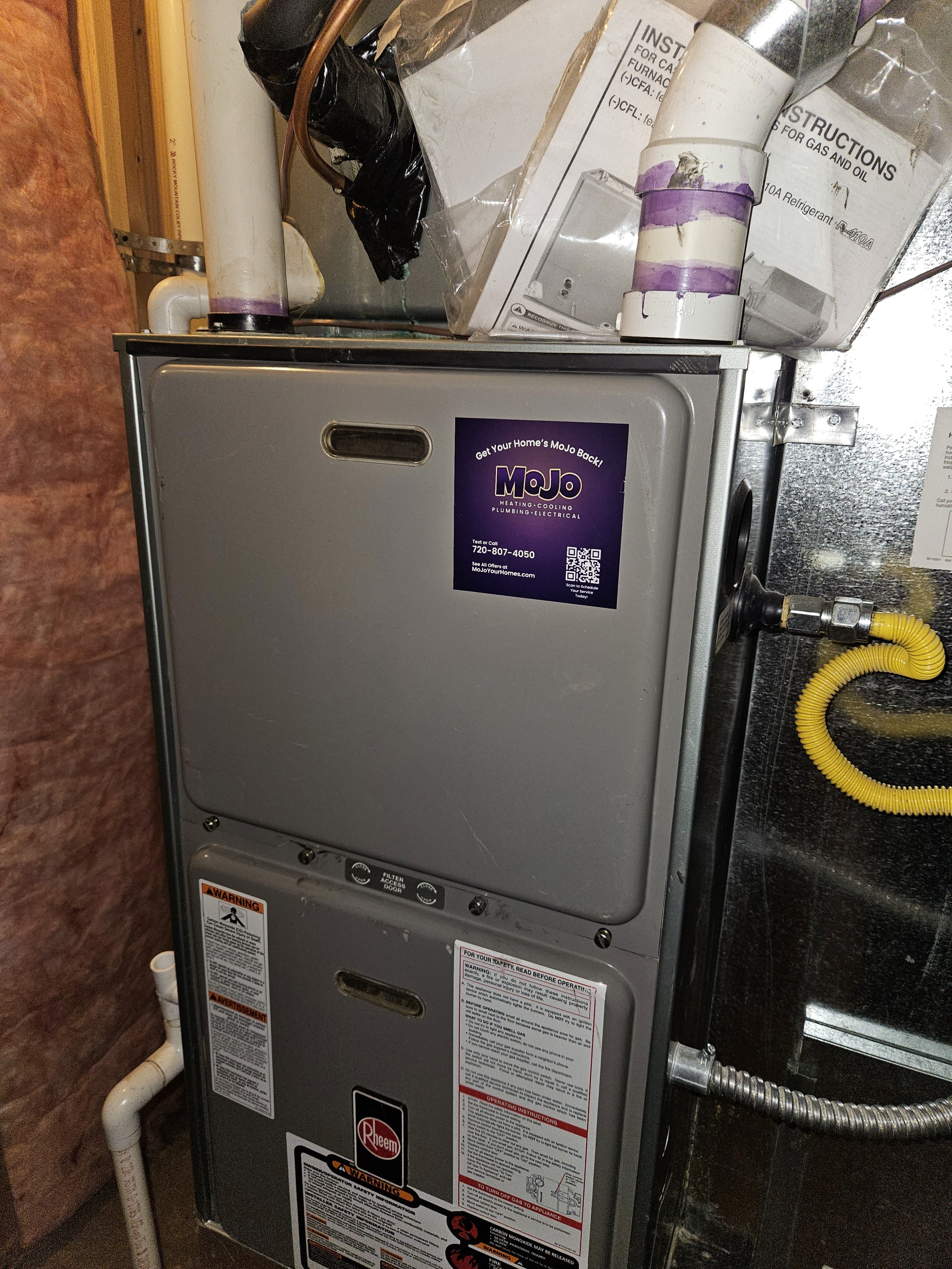 The image shows a gas furnace installed in a home utility space in Denver Colorado
